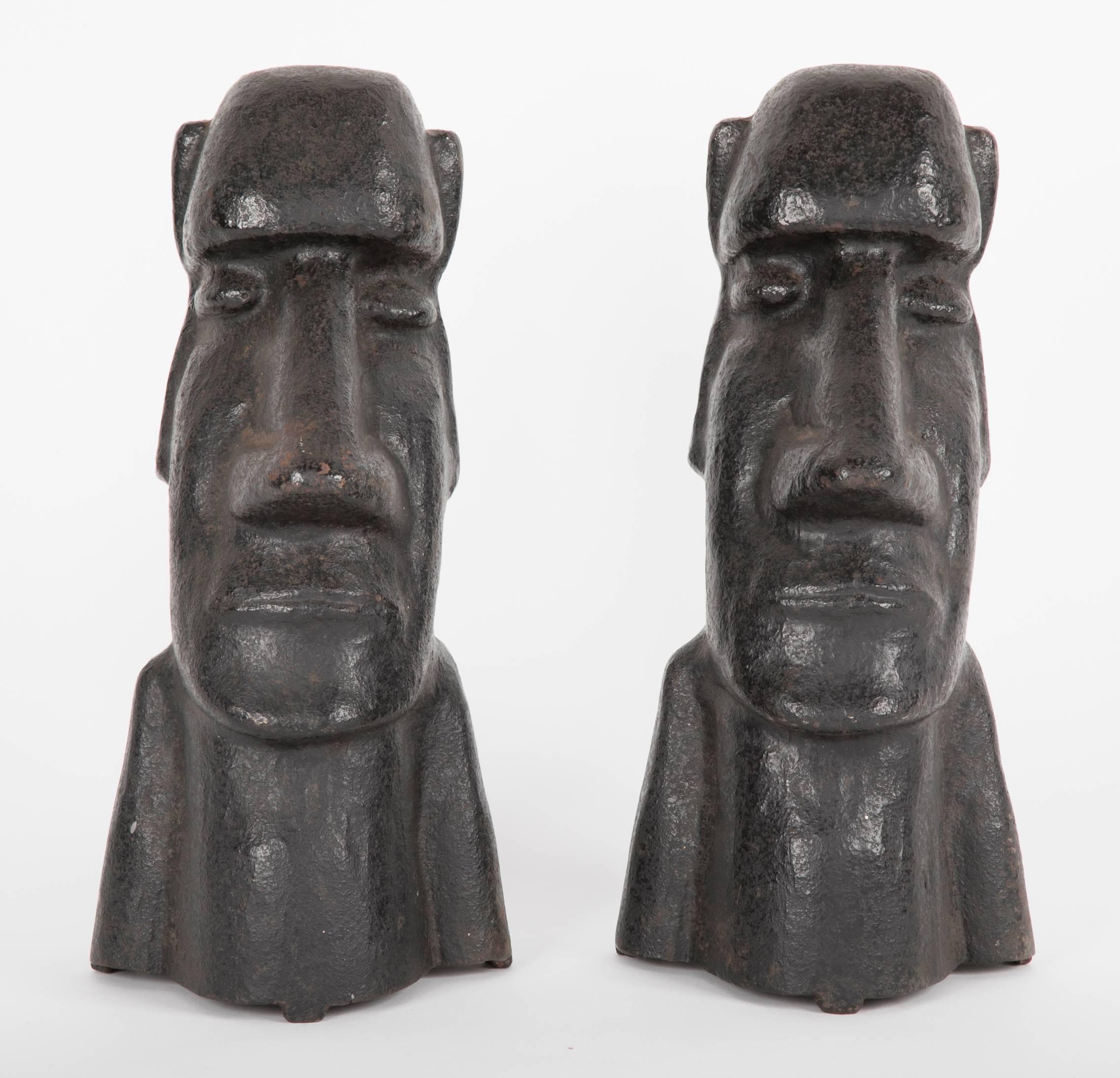 Early 20th century cast iron andirons in the form of the Easter Islands stone statues. Andirons do not have backs, circa 1900-1920.