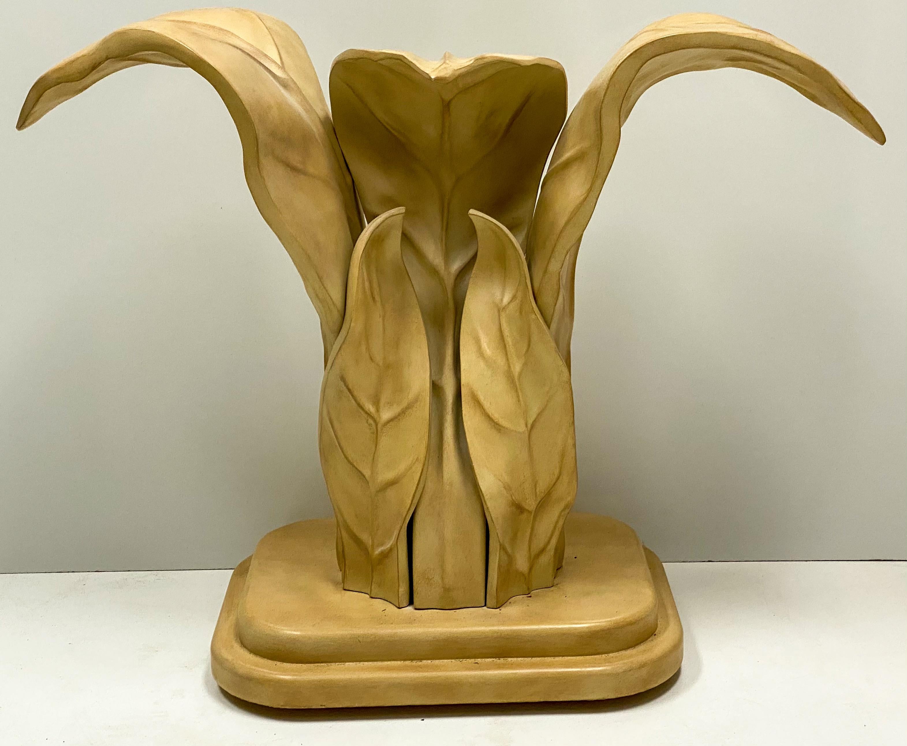 This is a 1970s modern organic leaf form console table by the Italian manufacturer Casa Bique.  It appears to be cast composition, and the leaves are banana leaves. It has a removable glass top and is in very good condition. Glass is 60” in length,