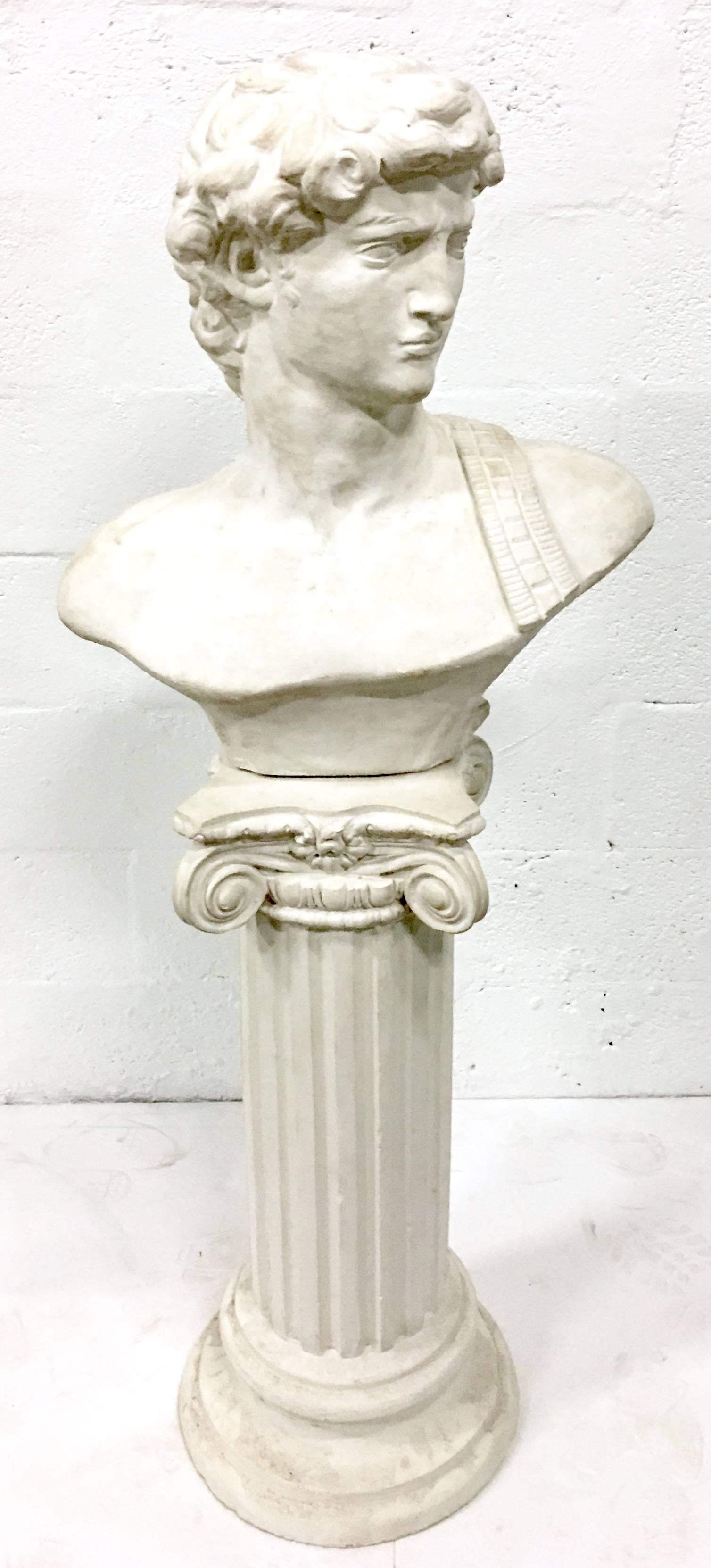 20th century cast polished stone roman bust and pedestal. Extremely well executed, with fantastic attention to detail. The bust features an iron rod at the bottom that inserts into the pedestal for stabilization. Bust only measures: 24