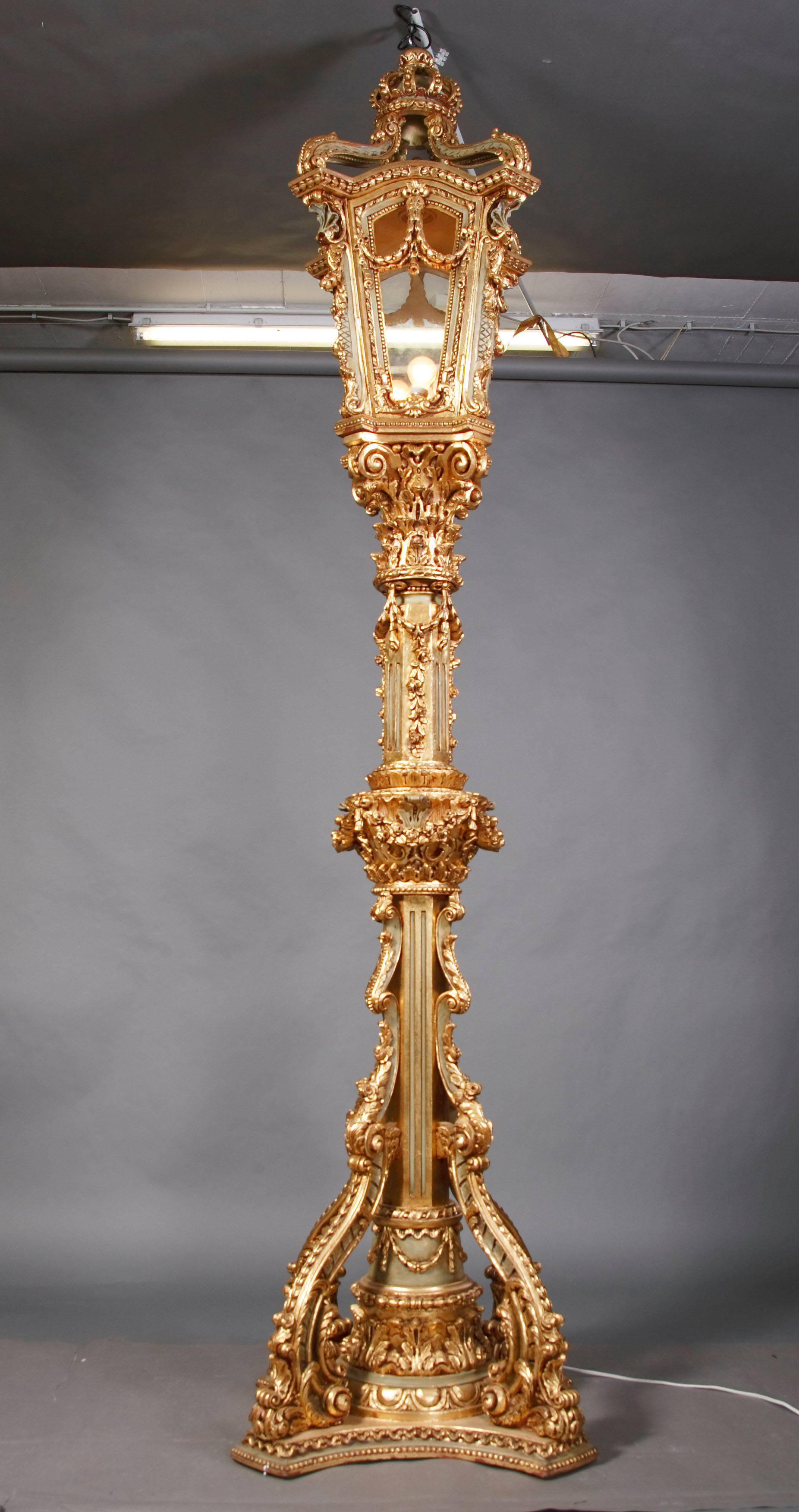 Castle-Worthy monumental candelabra.
Highly valuable, carved beechwood, inlaid and gilded. Multi structured in detail, finely carved pillar-shaft on four sided, retracted, graded pedestal, the under part of the pillar-shaft is flanked by four