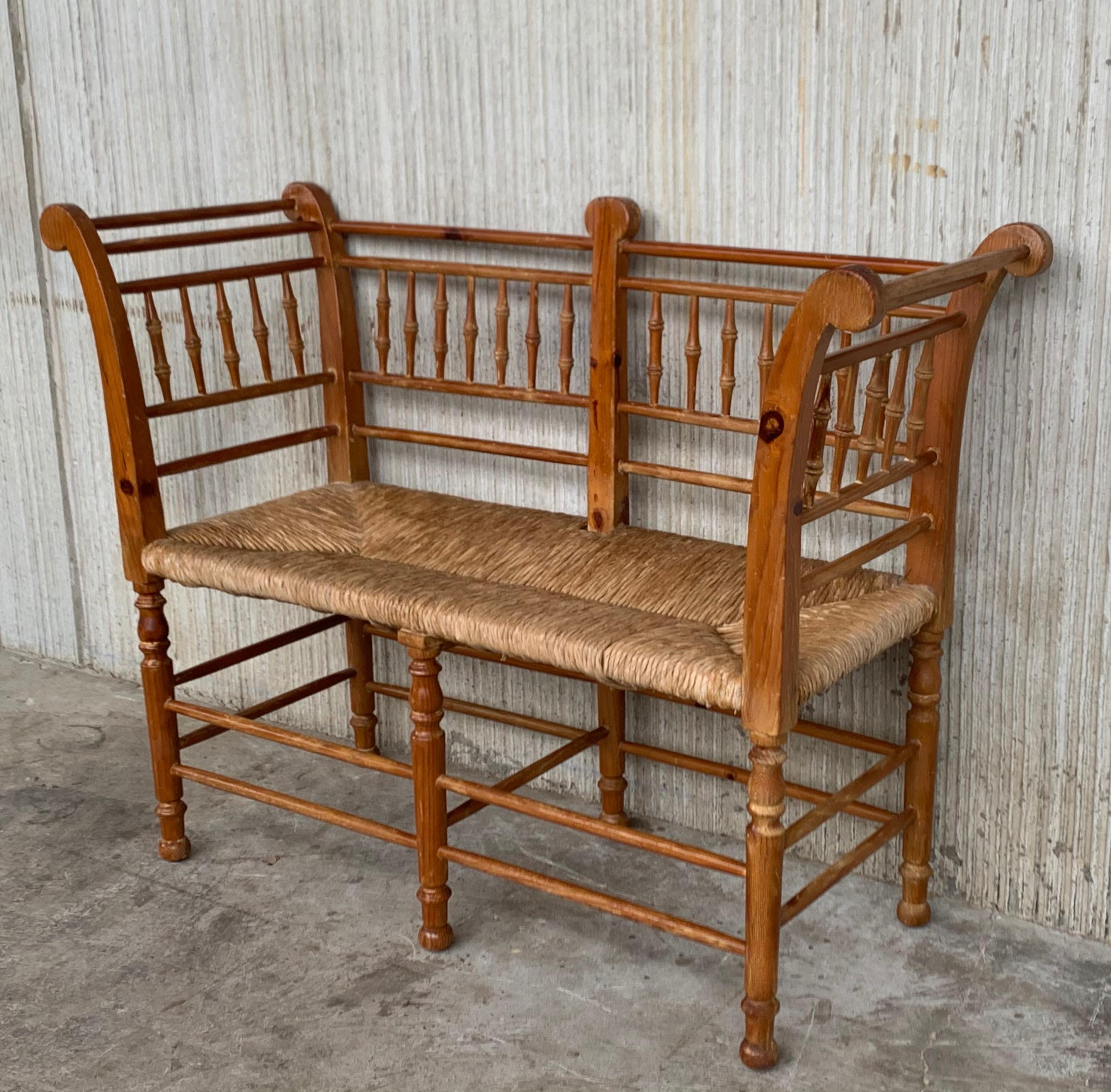 Midcentury sofa, settee or bench in the Spanish style with cane back and turned bars typical of this period. Shown in original condition, please note price includes refinishing.


 