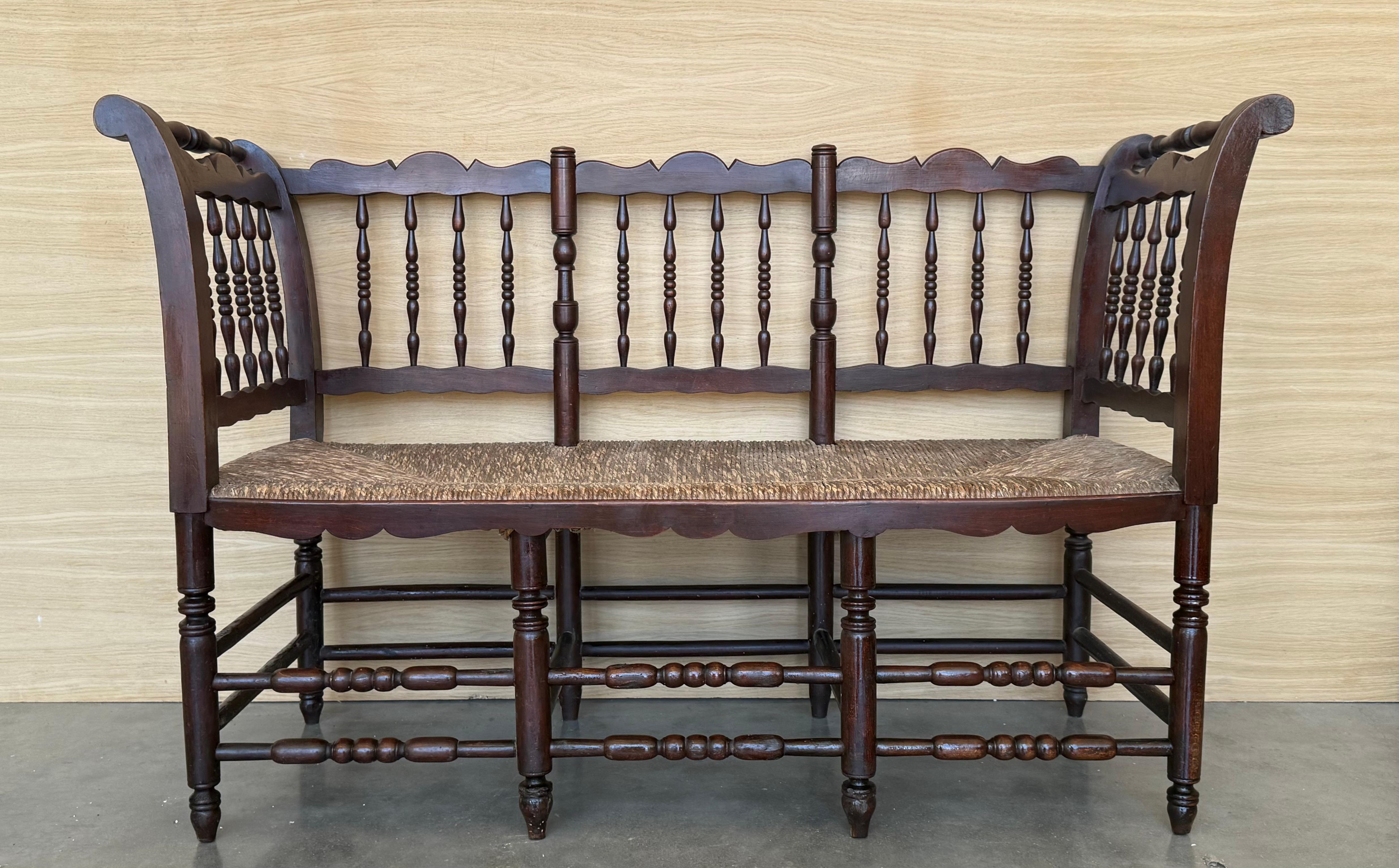Rare midcentury sofa, settee or bench in the Spanish style with cane back, it has a turned bars typical of this period. Shown in original condition, please note price includes refinishing.


 