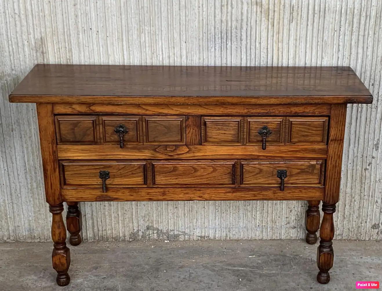 20th century Spanish antique pine (mobila) console sofa table with the three drawers and original iron hardware.
You can use like a commode or chest of drawers
This elegant antique pine console was crafted in Spain, circa 1900. The sofa table with