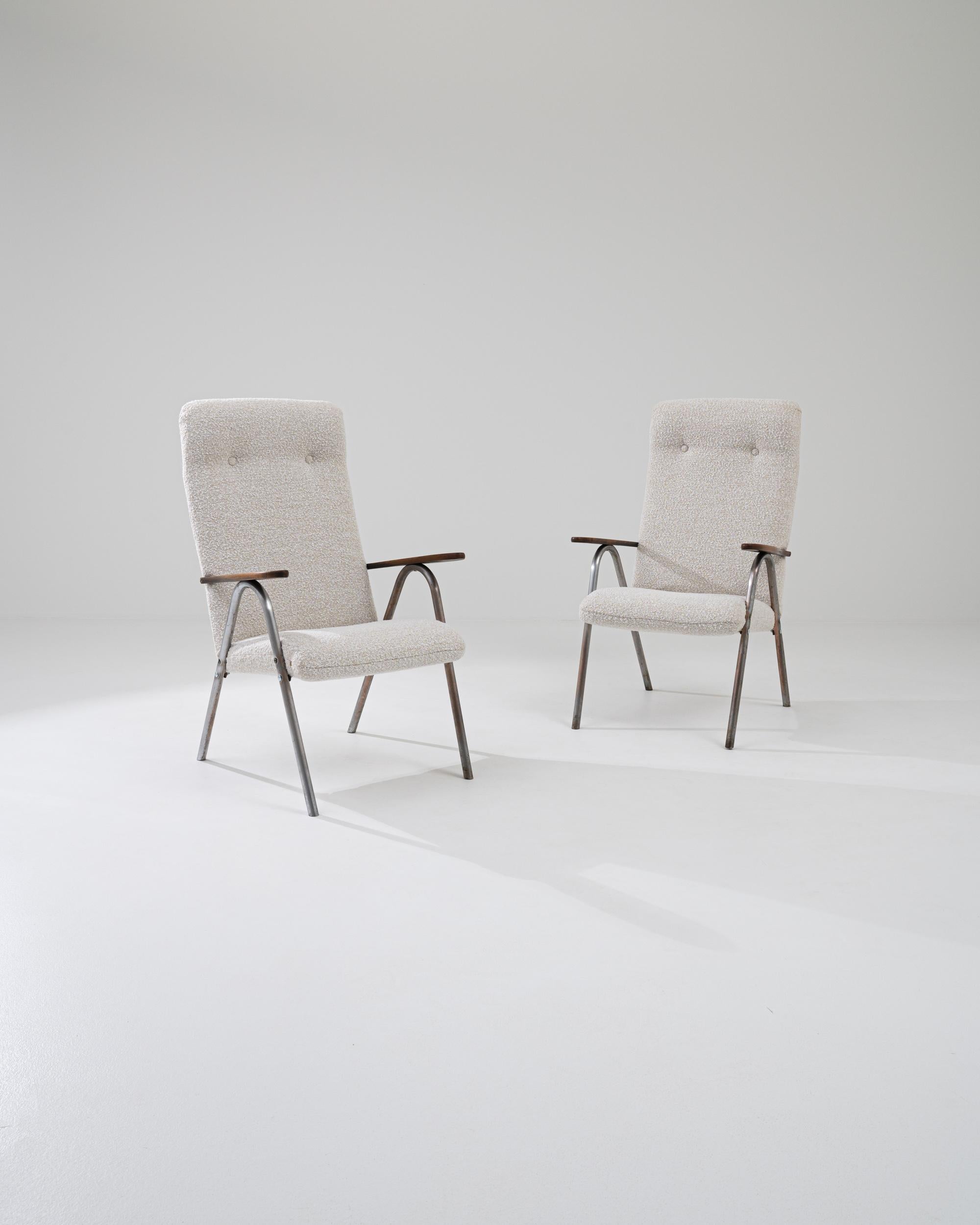 With their clean, graphic form, this pair of vintage armchairs offer an impeccably stylish accent. Made in the 20th century, the design is typical of the unique Central European Modern aesthetic—the influence of the Bauhaus school is clearly visible