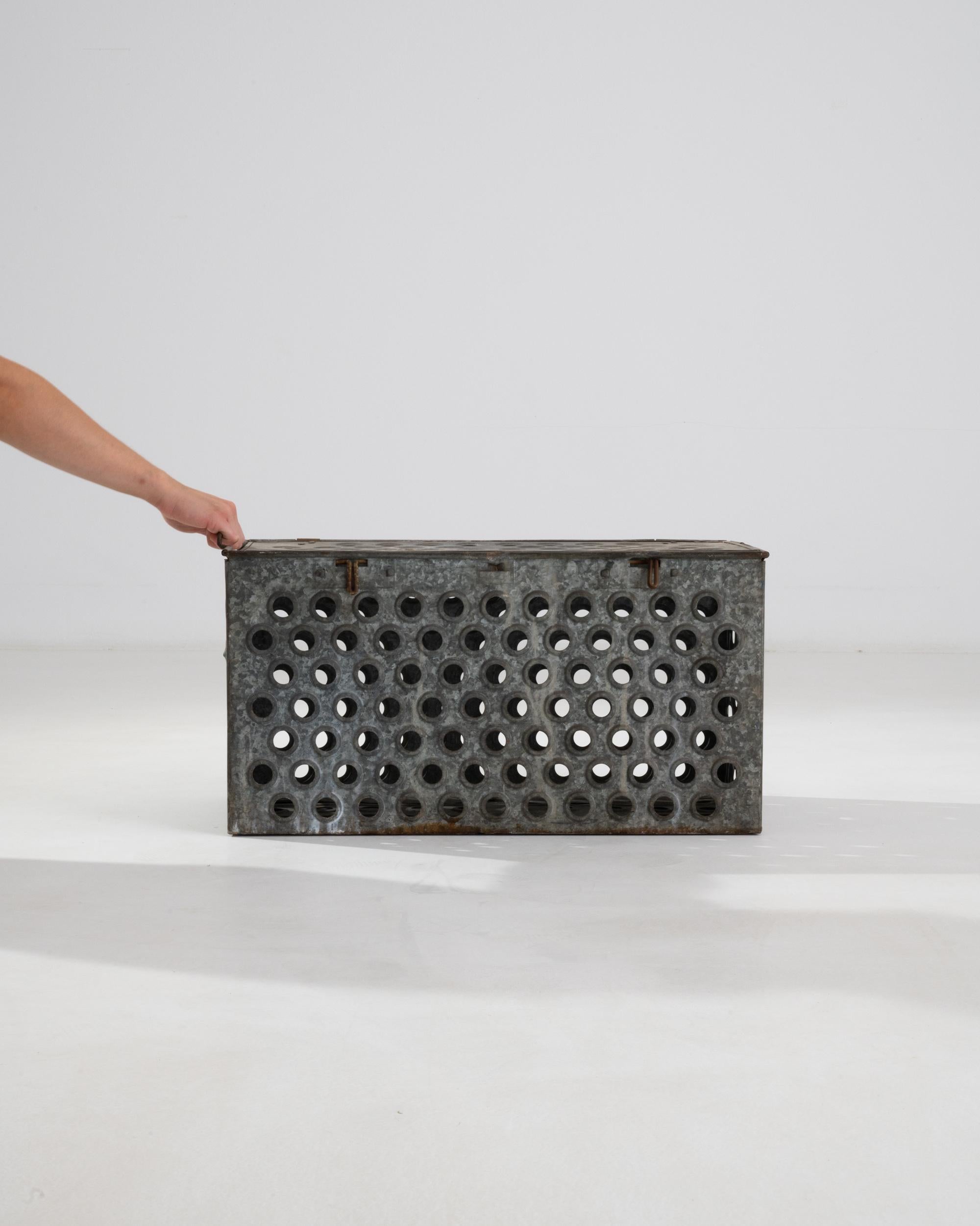 This 20th Century Central European zinc box is a remarkable piece, showcasing utilitarian design and industrial aesthetics. The box’s durable zinc construction ensures longevity, while the distinctive patina it has acquired over the years adds depth