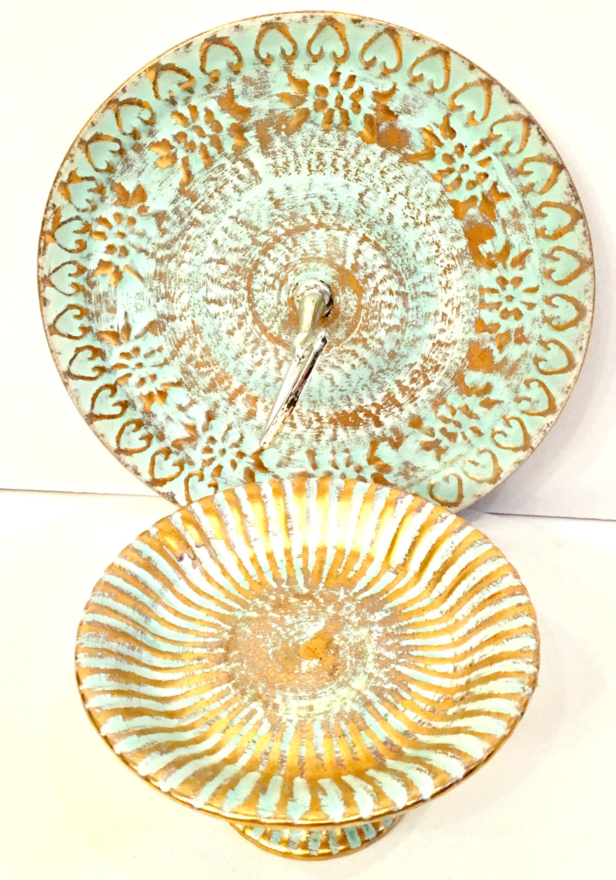 Mid-20th century set of two ceramic hand painted aqua and 22-karat gold serving pieces by Stangl Pottery. This two piece set includes a pedestal plate and chrome handled serving platter. Each pieces is signed on the underside, Stangl.
The pedestal