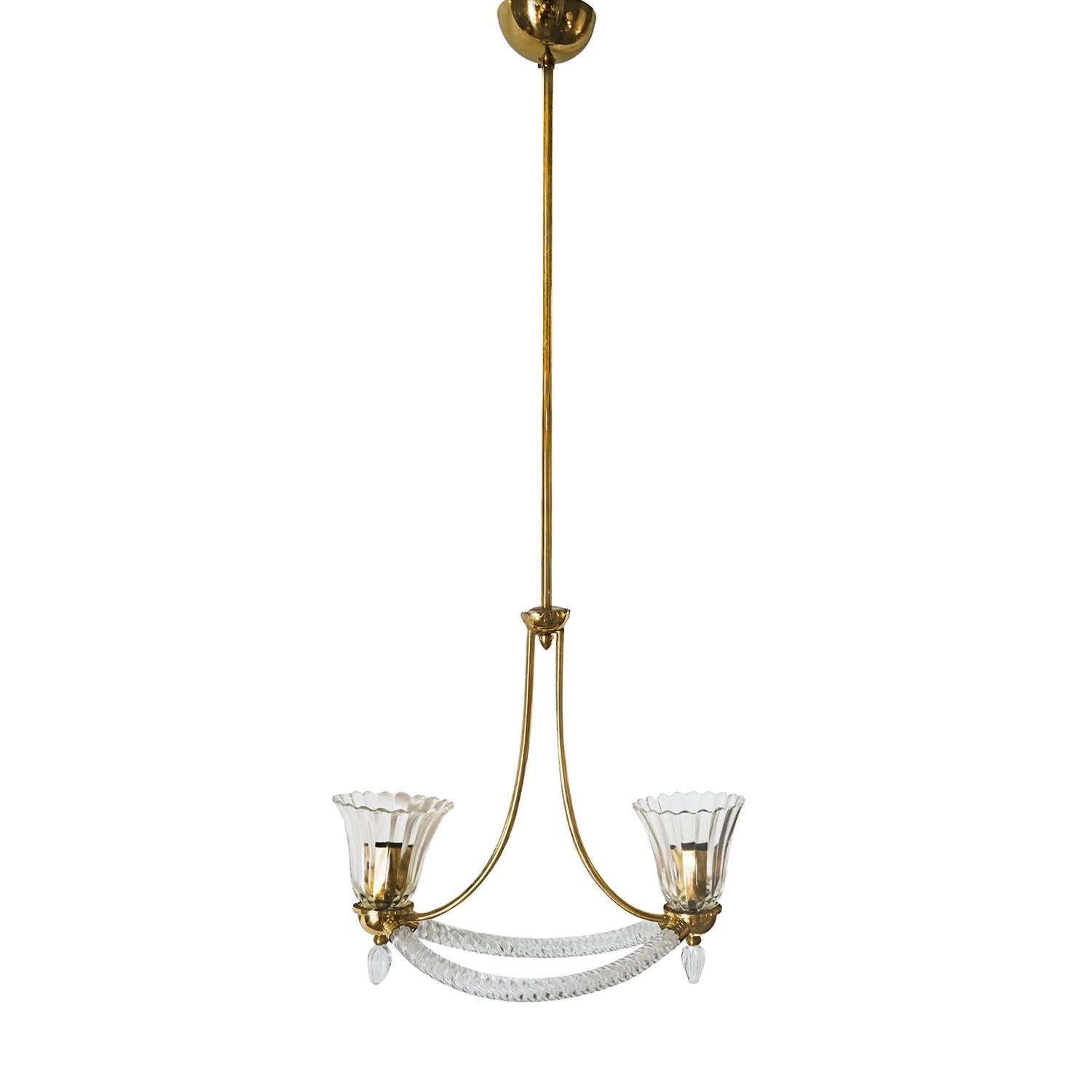 A vintage Mid-Century Modern Italian ceiling lamp made of a brass structure and hand blown Murano glass, having two “ Rostrato “ light shades, enhanced by brass details, supported by two curved Murano glass arms, each of which are featured with a