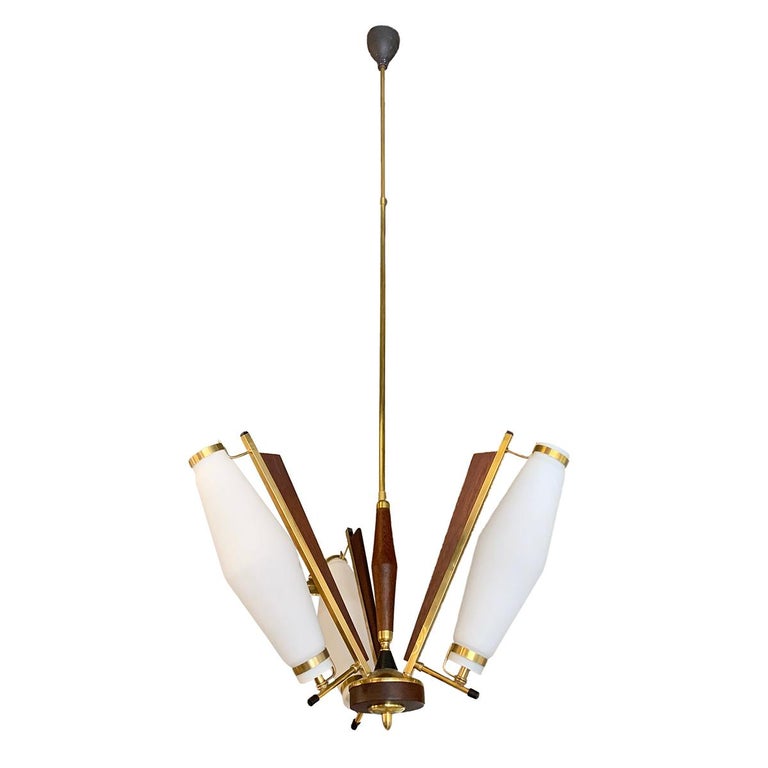 A vintage Mid-Century Modern Italian three armed ceiling chandelier, produced most likely by Stilnovo in good condition. The pendant is made of a brass structure with walnut inserts and hand blown opaline glass. Each shade is featuring a one light