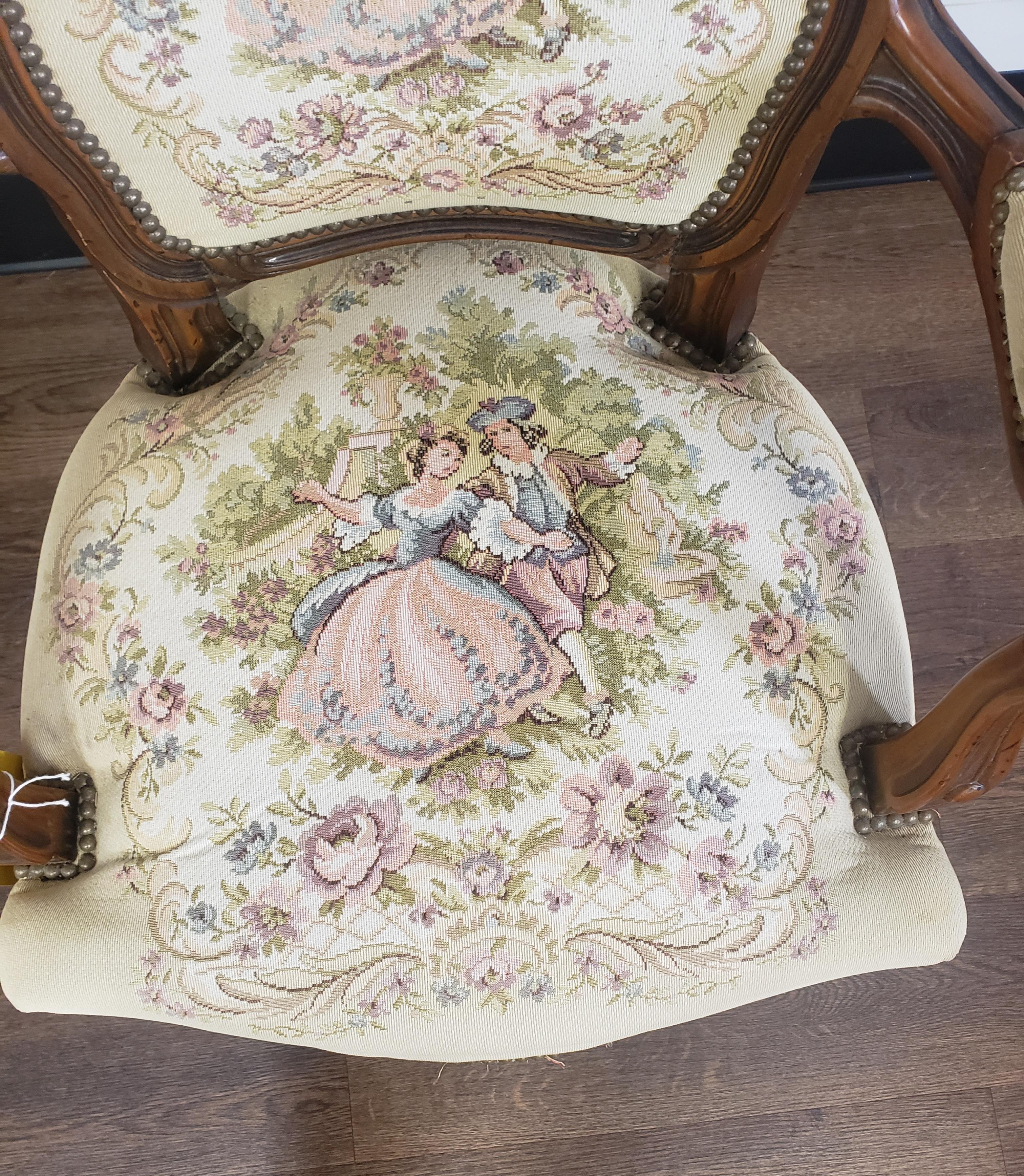 An Italian made Chateau d'Ax Spa French Louis XV style Tapestry armchair in good vintage condition with firm seat and beautiful carvings. Listing includes solid wood frame, beautiful wood grain, distressed finish, cabriole legs, quality Italian