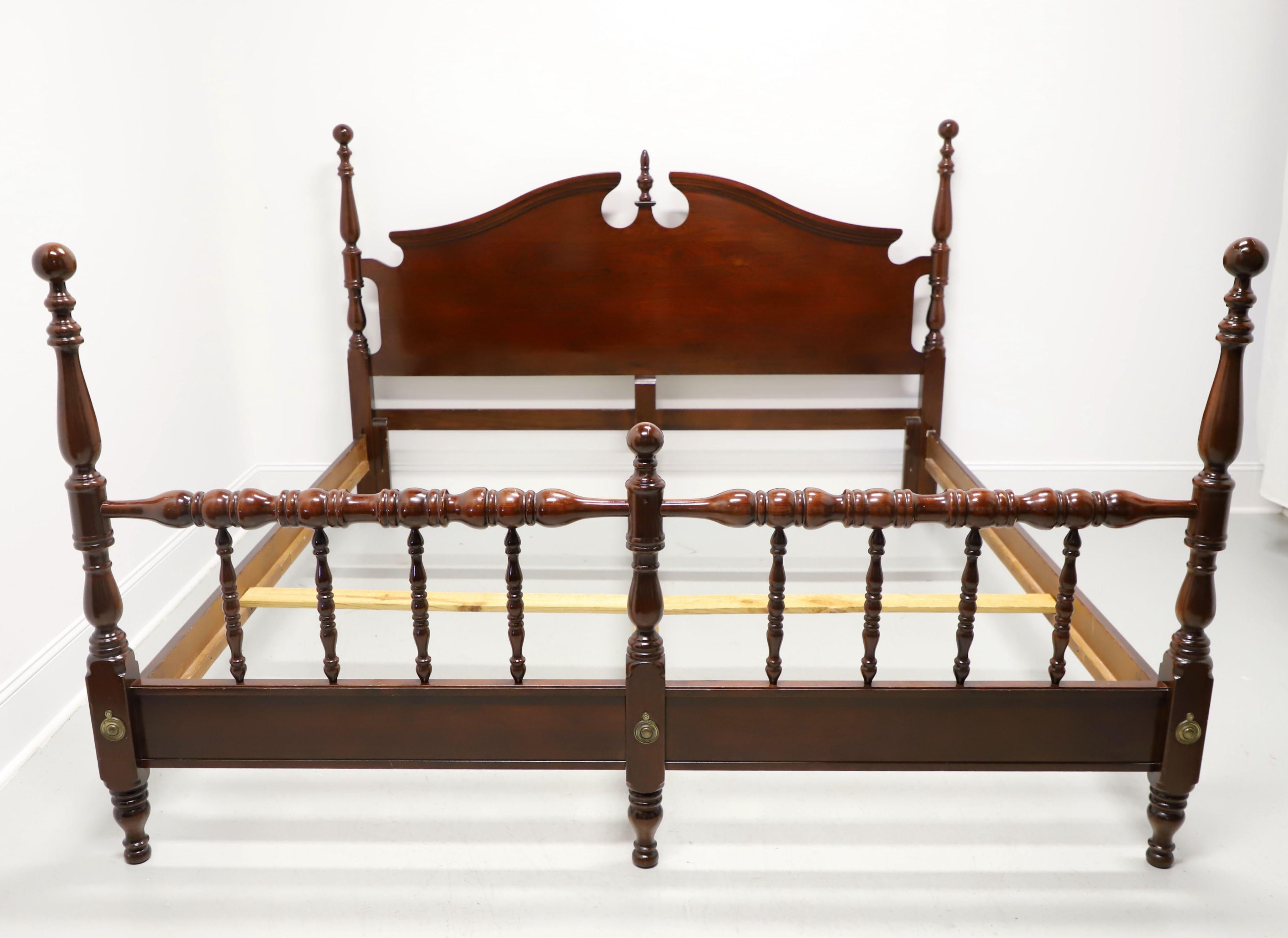 A Chippendale style king size short poster cannonball bed, unbranded. Solid cherry wood, headboard with carved pediment & center finial, four turned short posts capped by cannonballs finials, footboard with turned post detail & a shorter center post