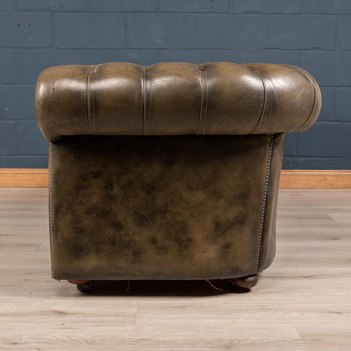 A large 20th century leather Chesterfield sofa, this is a fashionable evergreen capable of uplifting the interior space of any contemporary or traditional home, the classic colour combining refined elegance and taste. 

Measures: Height: