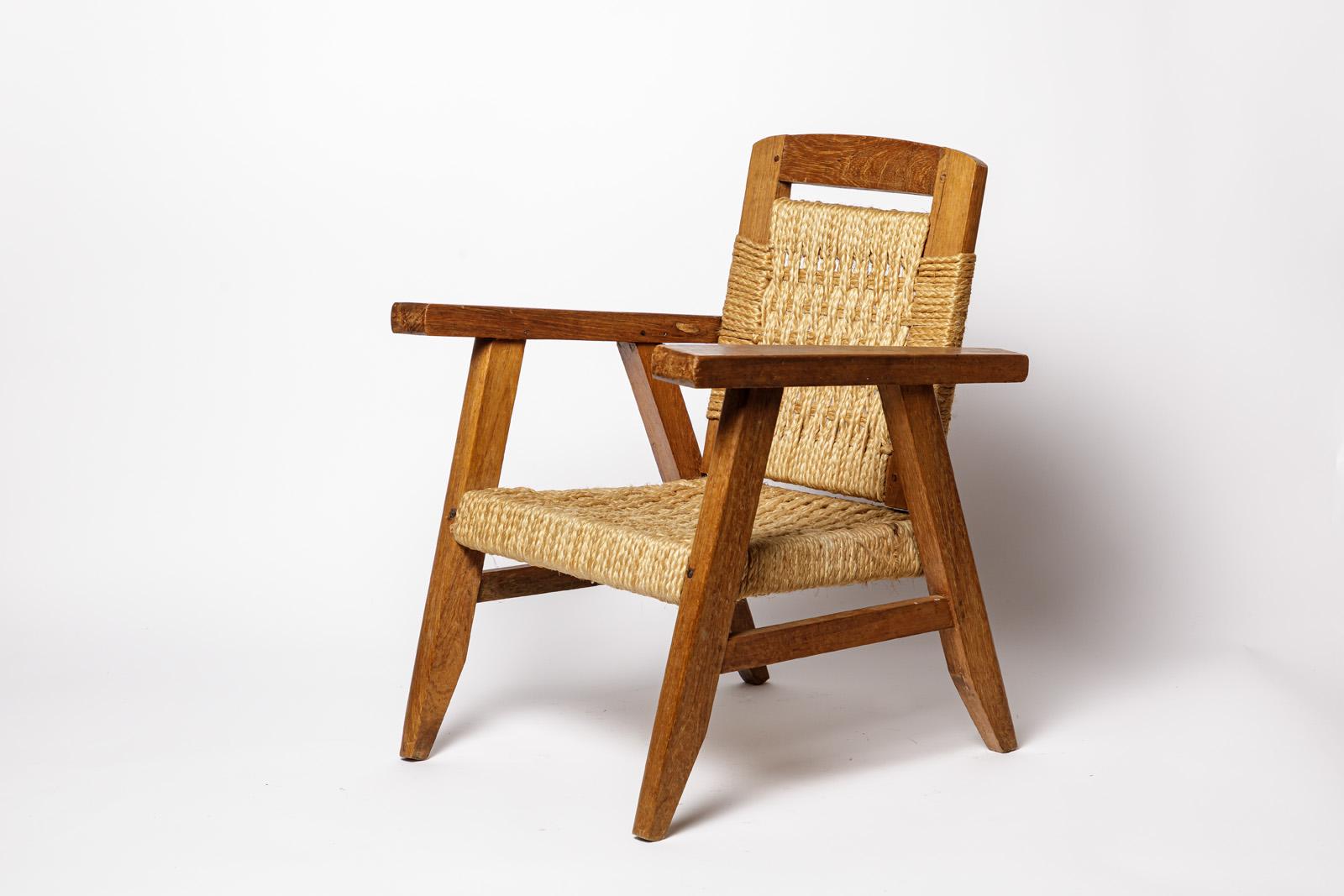 French 20th century children design wood and cord lounge chair style Audoux Minnet 1/2 For Sale