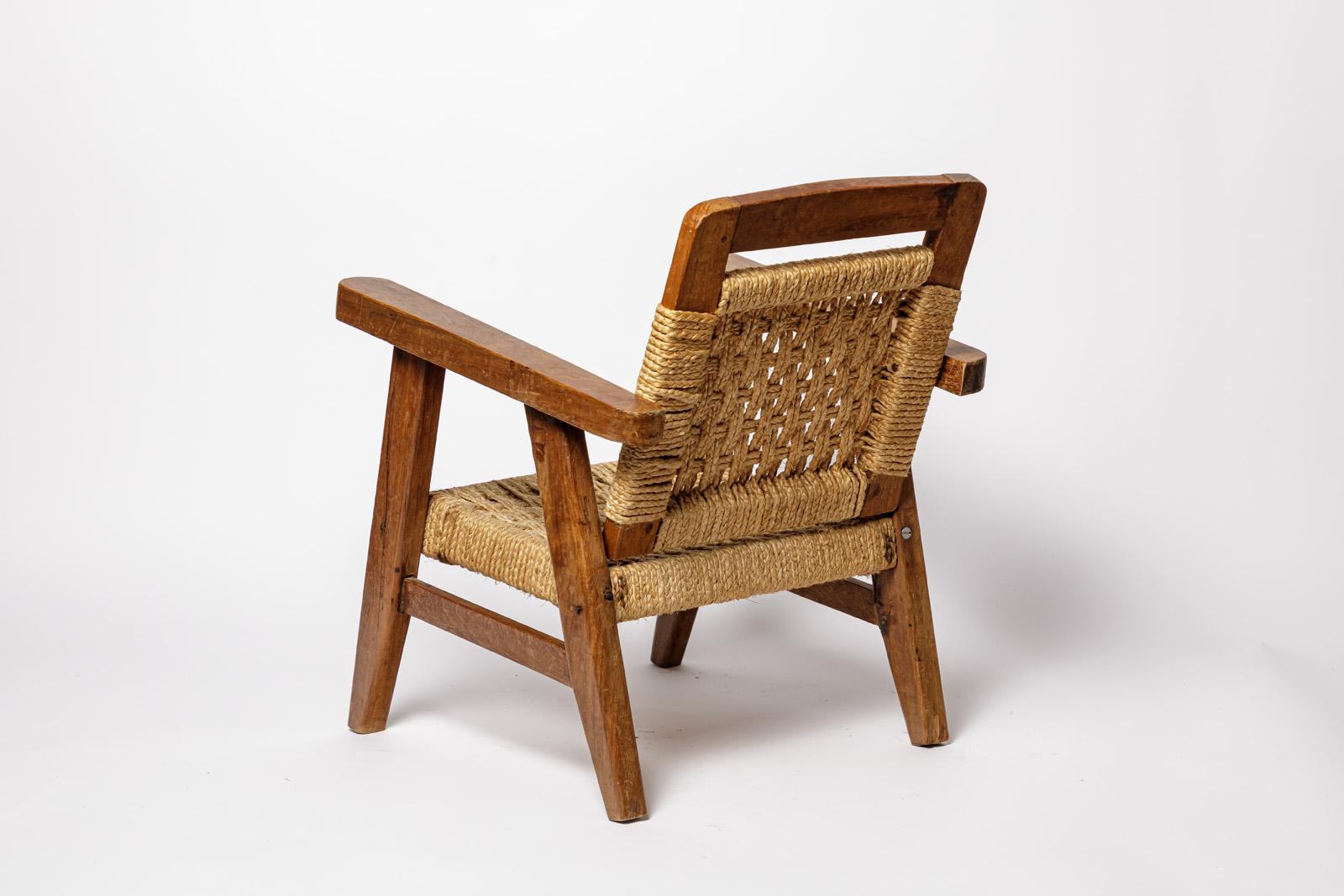 Français 20TH CENTURY DESIGN Chaise longue en bois et corde style Audoux Minnet 2/2 en vente