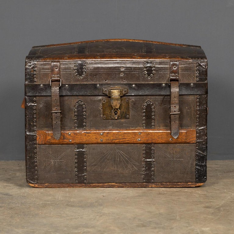 Antique early-20th century child’s travelling trunk, steel bound with wooden slats and covered with leather, it has it’s original lock and leather straps, the interior is also original.

Condition
In Good Condition - Wear As