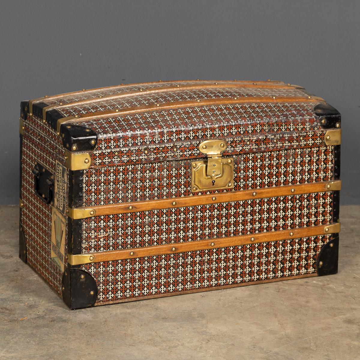 Antique early-20th Century steel bound travelling trunk for a child with wooden slats and a stencilled paper covering with original lock. Inside are the original trays and stencilled lining.

Condition
In Good Condition - Wear As