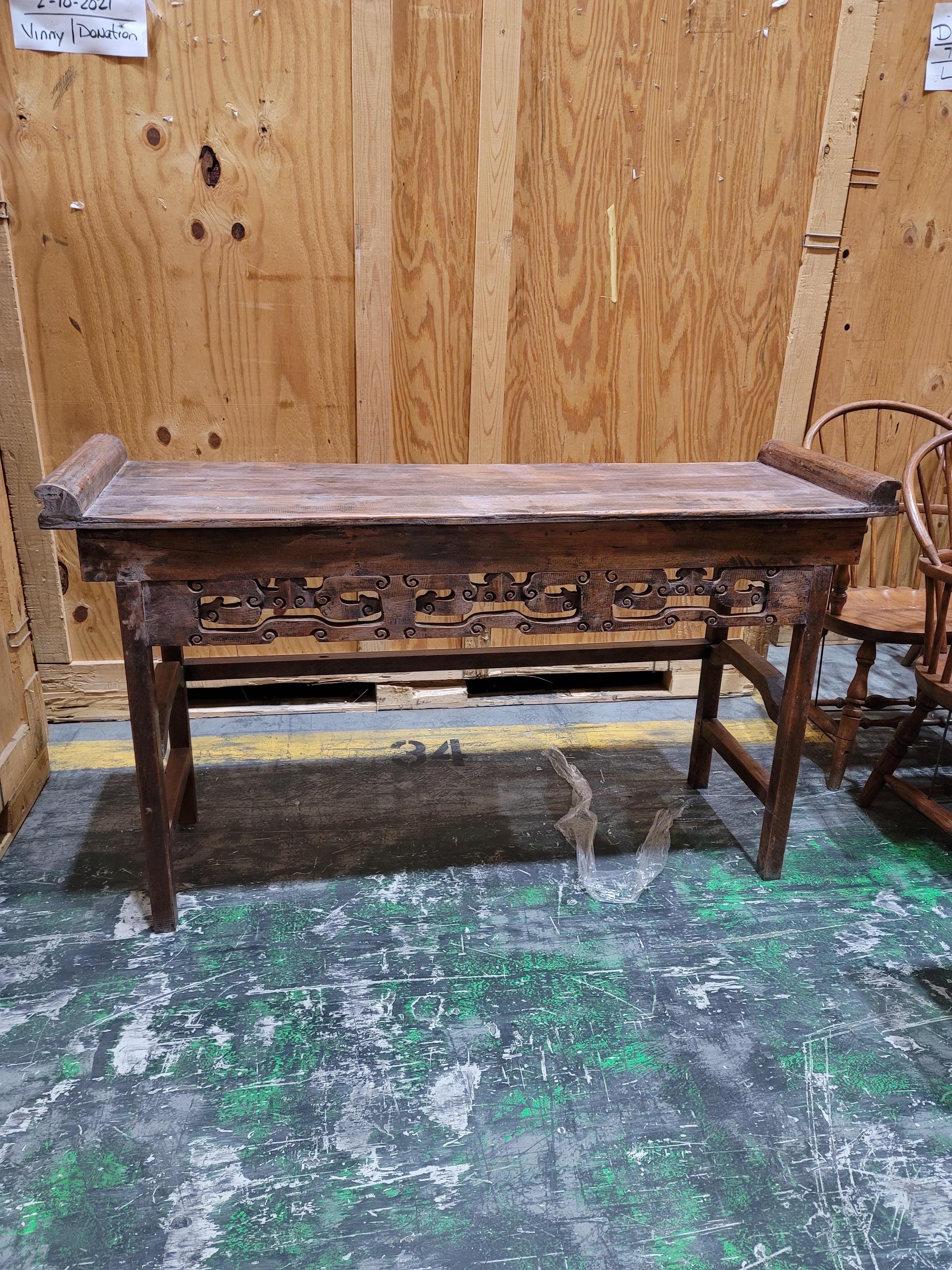 20th Century Chinese Altar Table
Scrolling cut out design along top rail of altar table. General wear, good overall condition.

18