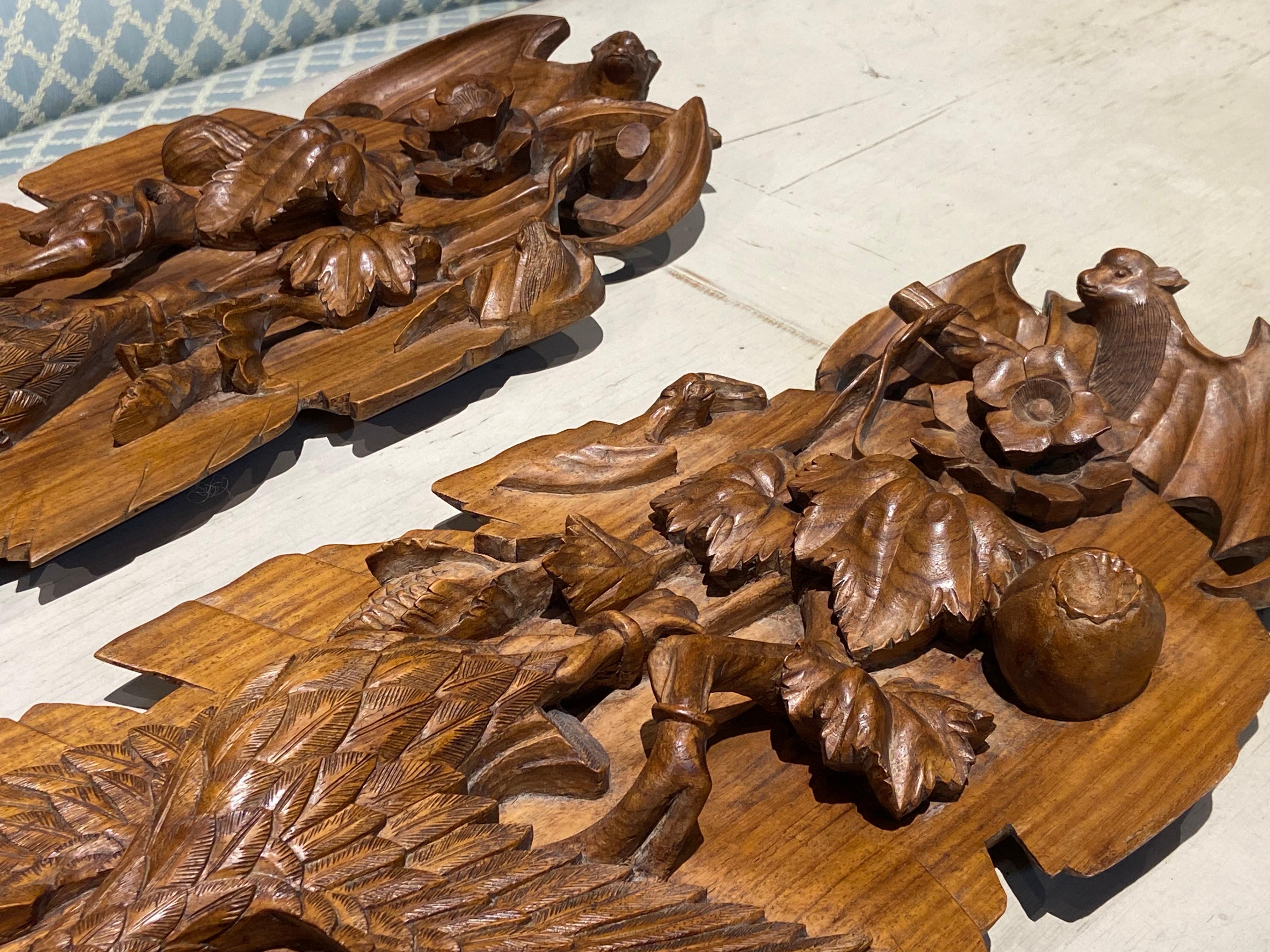 20th Century Chinese pair of long hand carved teak panels decorated with bats, birds and frogs in a very vivid way. Very good original condition without restorations.
