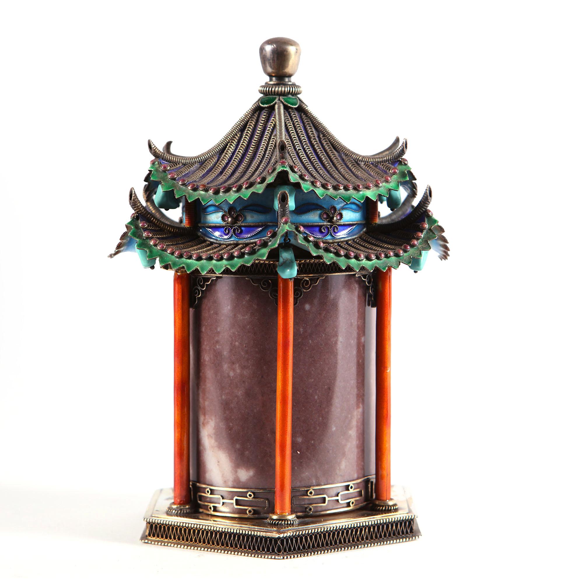 A fine 20th-century Chinese casket in the form of a temple with a removable silver-gilt wirework and enamel canopy hung with turquoise beads, above a red jade cylindrical body on a hexah=gonal silver-gilt base with fret cut fencing and coral red