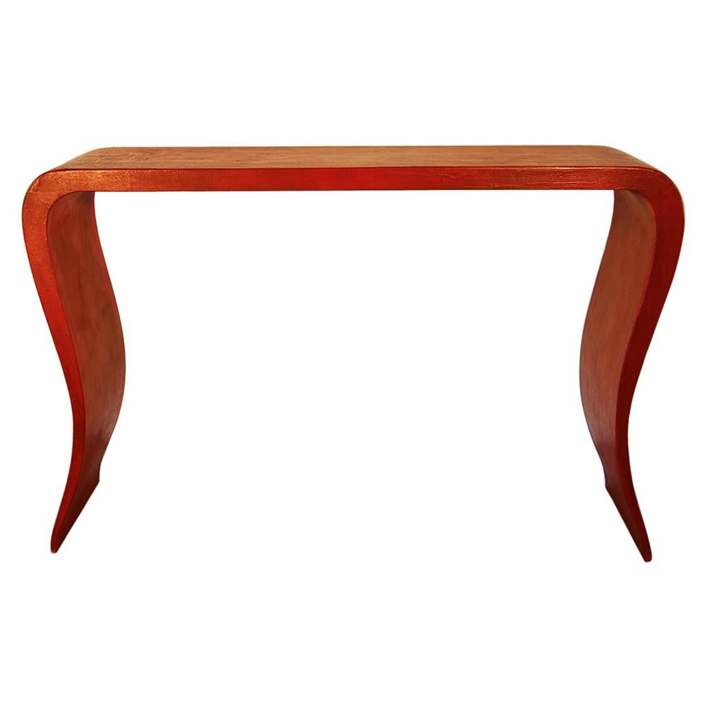 20th century Chinese console table in red lacquered wood.