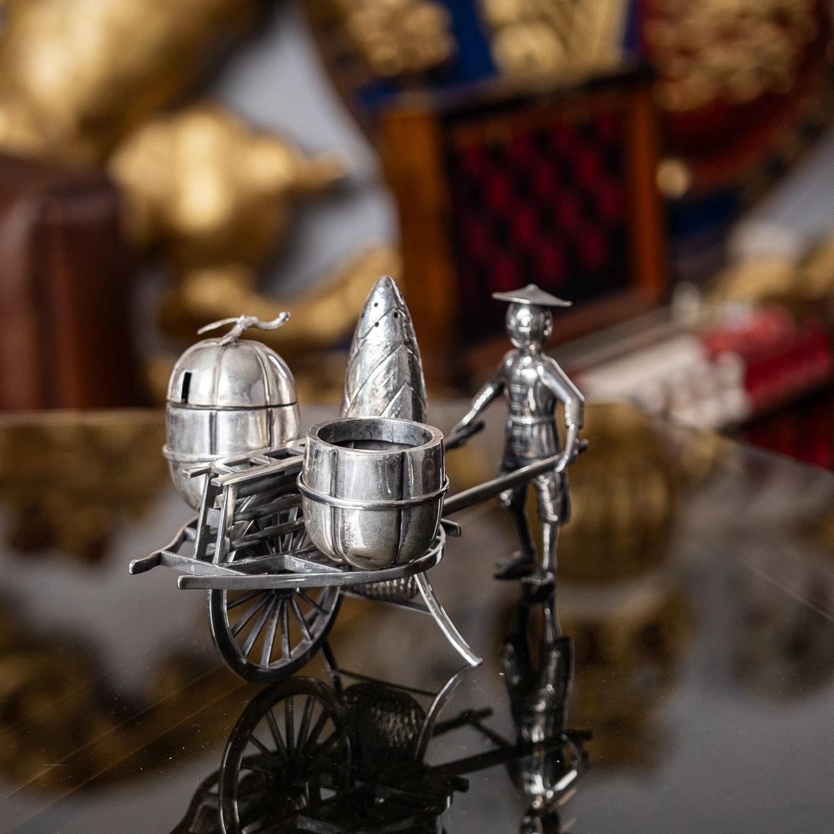 Antique early 20th Century Chinese novelty solid silver condiment set, comprising a pepperette, salt and mustard pot, fitted in a traders pushcart. Hallmarked Chinese Export Silver, Maker's mark for Nobuki.

CONDITION
In Great Condition - No
