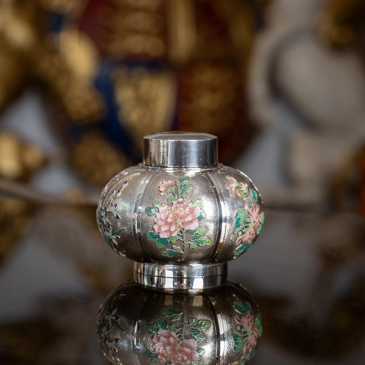 Antique early-20th Century Extremely Rare Chinese export solid silver & enamel tea caddy, the melon shaped body sides are applied with shaded enamels, depicting blooming chrysanthemums & iris flowers on matted ground. The caddy is of good