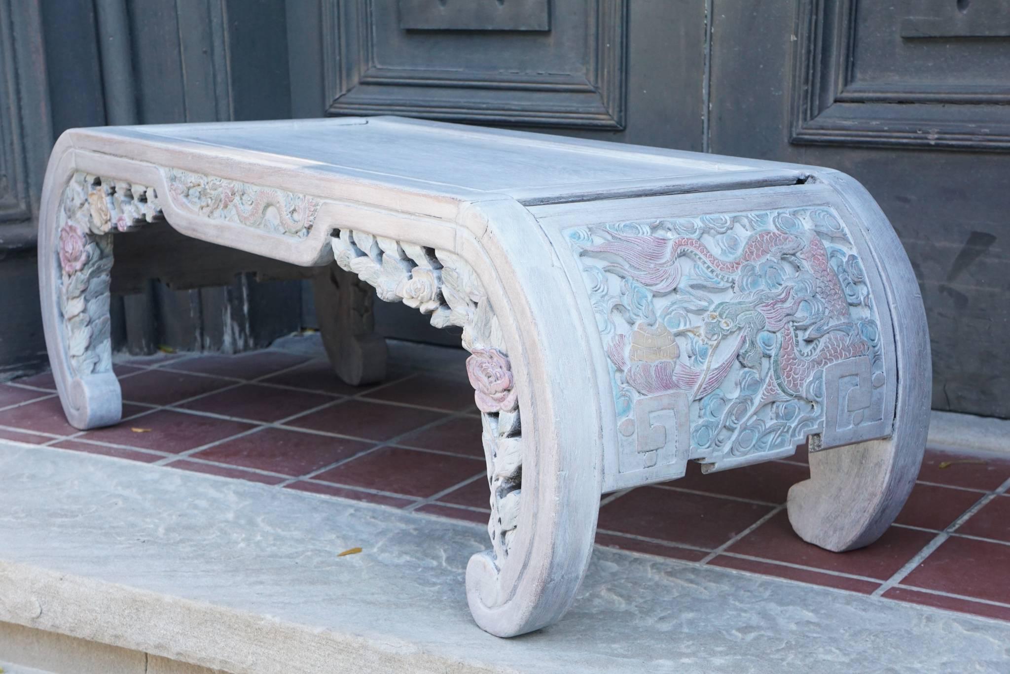 Made in China, this table is most likely rosewood but has been polychromed and limed in the early 20th century constructed in traditional Chinese joinery fashion the table would have been low as sitting on the floor with mats was common and low