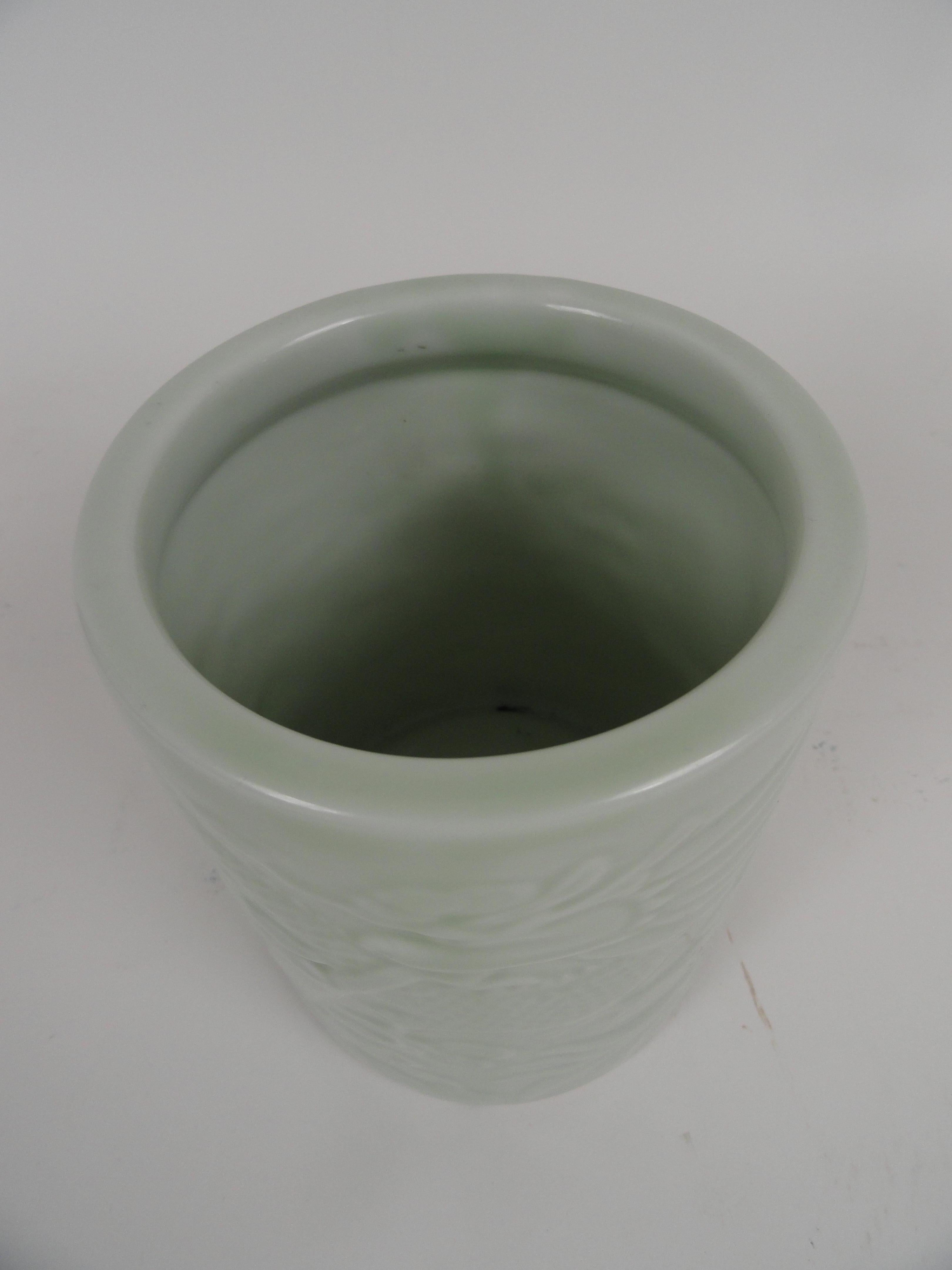 20th century Chinese porcelain brush pot in soft celadon.