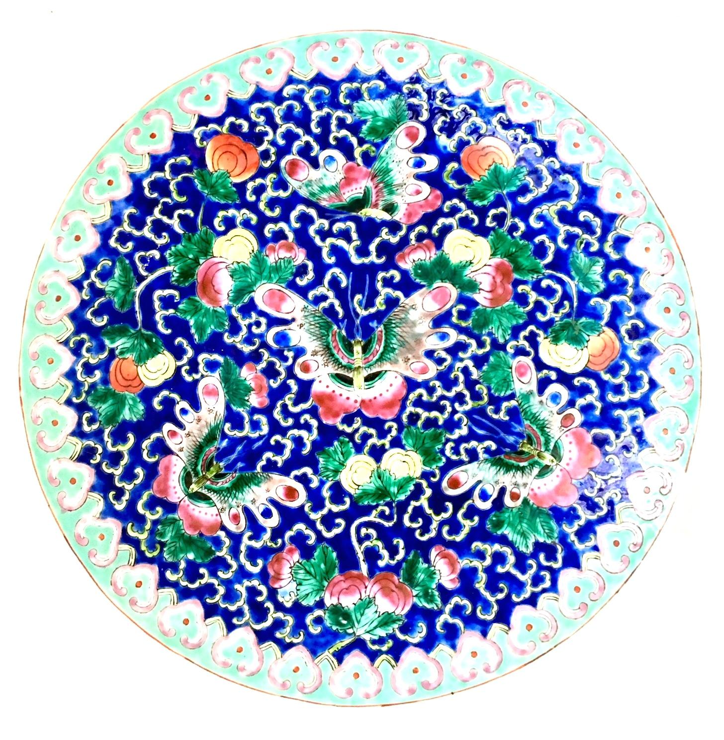 Mid-20th Century Chinese Export Porcelain Famille Large Butterfly Motif Center Bowl. This one of a kind artisan, hand-painted enamel and 22-K gold center bowl features a vibrant and vivid blue ground with turquoise and pink geometric border with a 