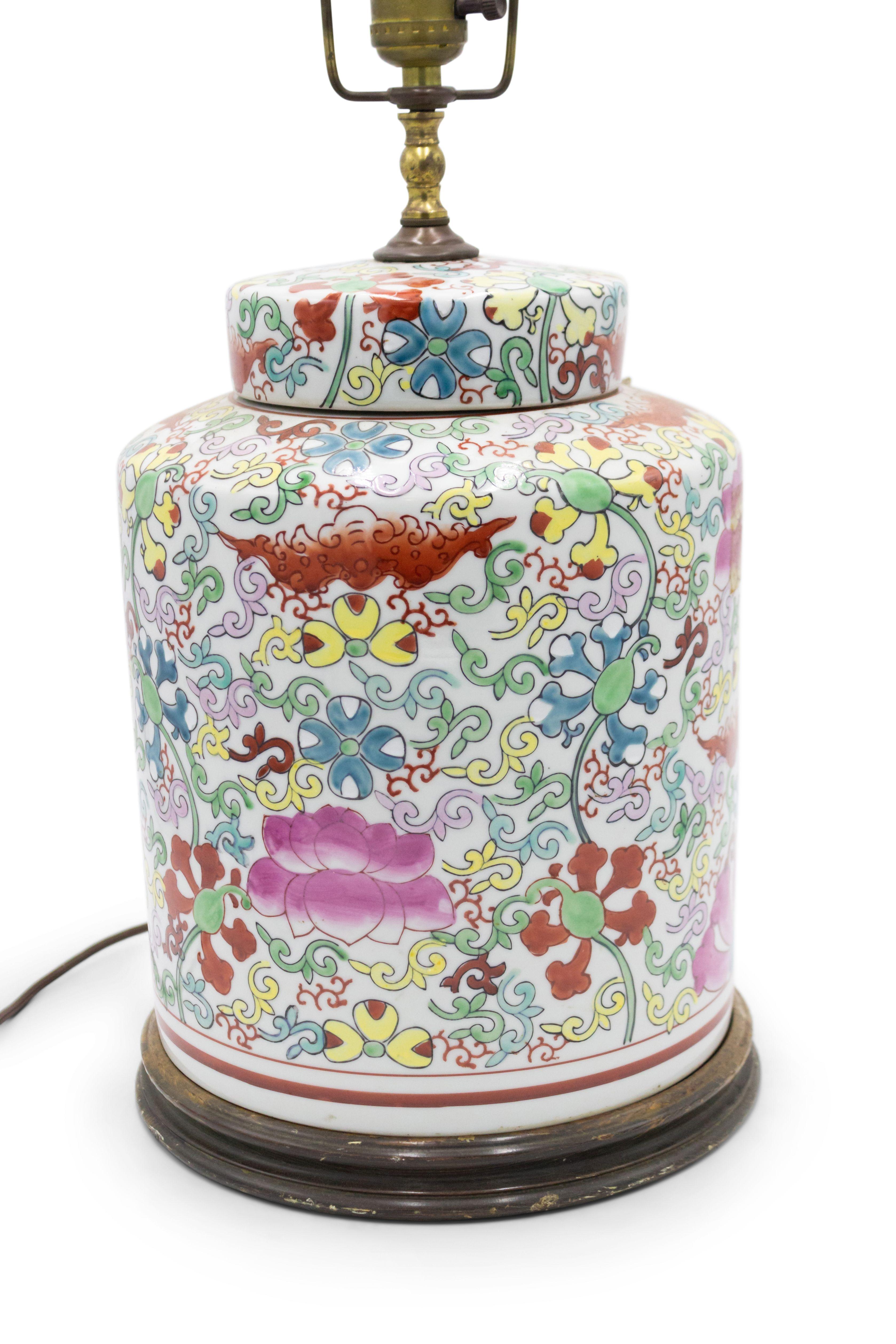 Asian Chinese style (20th Century) porcelain ginger jar cylindrical form lamp in red, green & yellow on a white field.