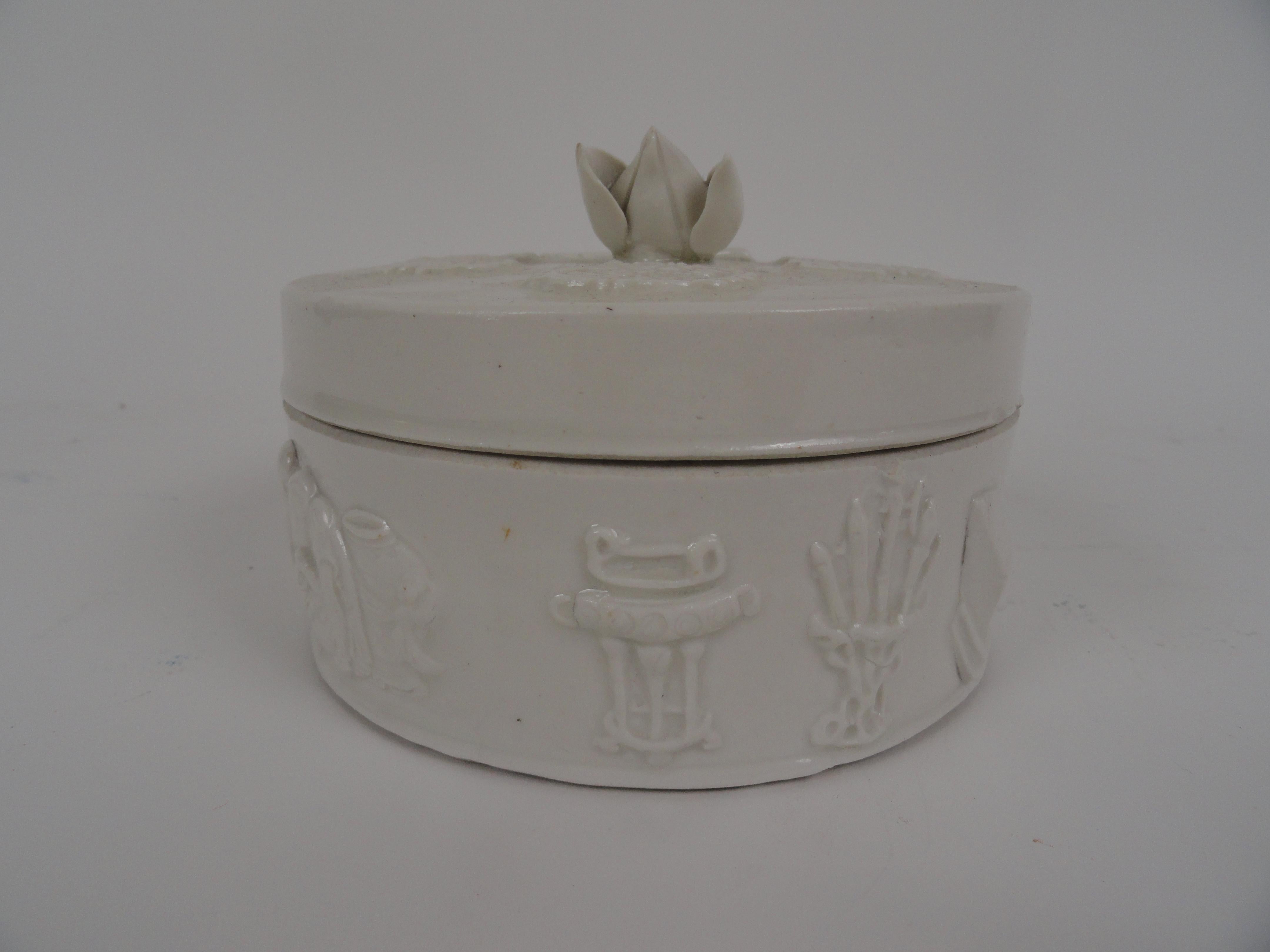 20th century Chinese round ceramic box with removable lid which has a lotus flower on top. 
Stamped 