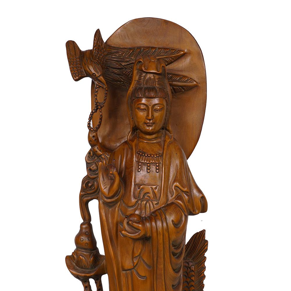 This magnificent Chinese wood carved Quan Yin Statuary. It shows very detailed hand carving works on it. It is all hand made and hand carved Quan Yin standing on the dragon from boxwood. A lot of detailed carving works on it. You can see from the