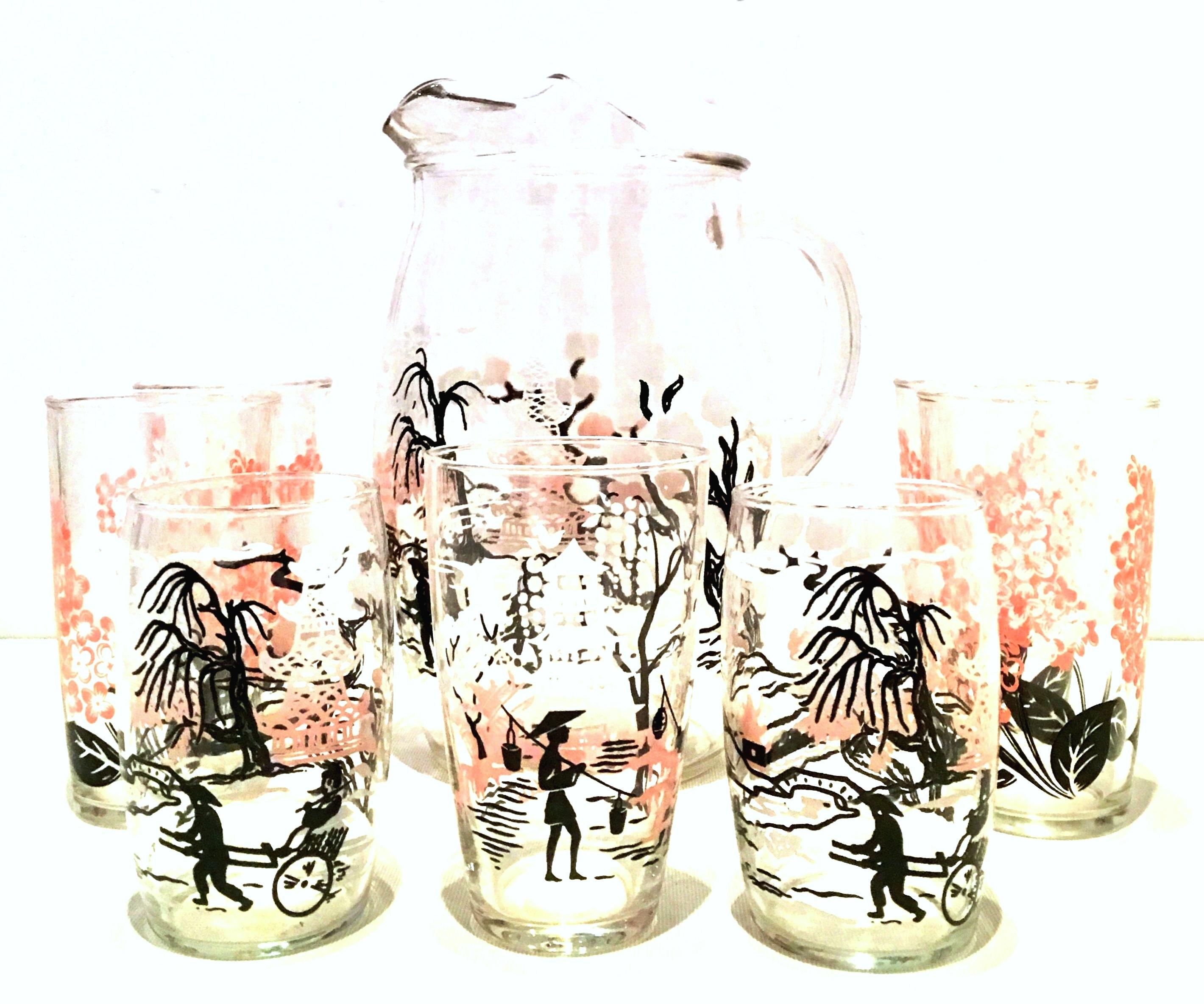 20th Century chinoiserie style printed drinks set of eight pieces. Features a pink, white and black Asian theme motif. Set included one handled pitcher and 7 tumblers.
Set includes three sized tumblers.
Four tall tumblers: 5