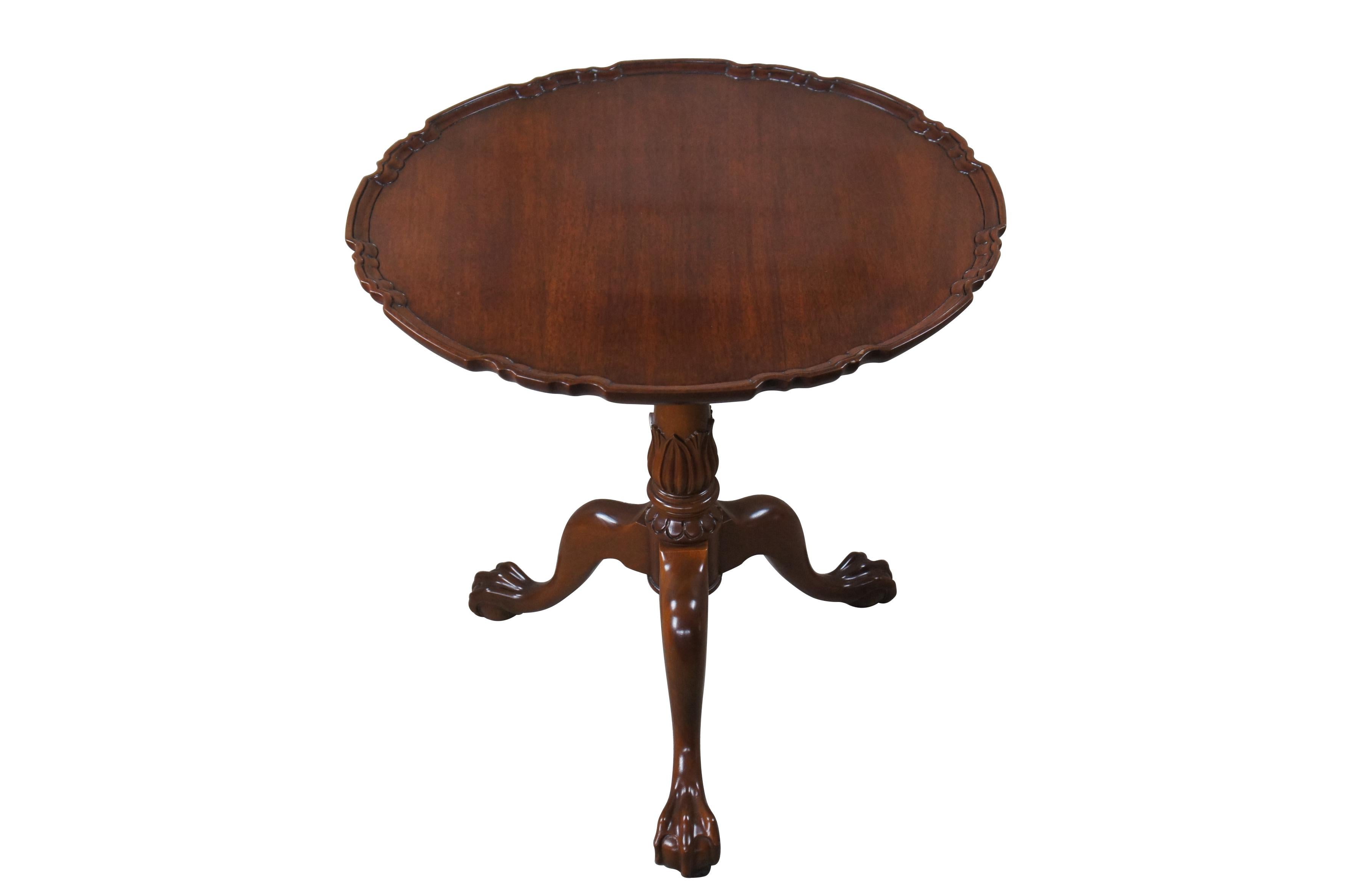 A large Chippendale style scalloped Pie Crust table, circa last quarter 20th century. Made from solid mahogany in the Jefferson Finish. Originally Purchased from William W. Sauer Associates Ltd. Bethesda, MD in 1982. the scalloped top is supported