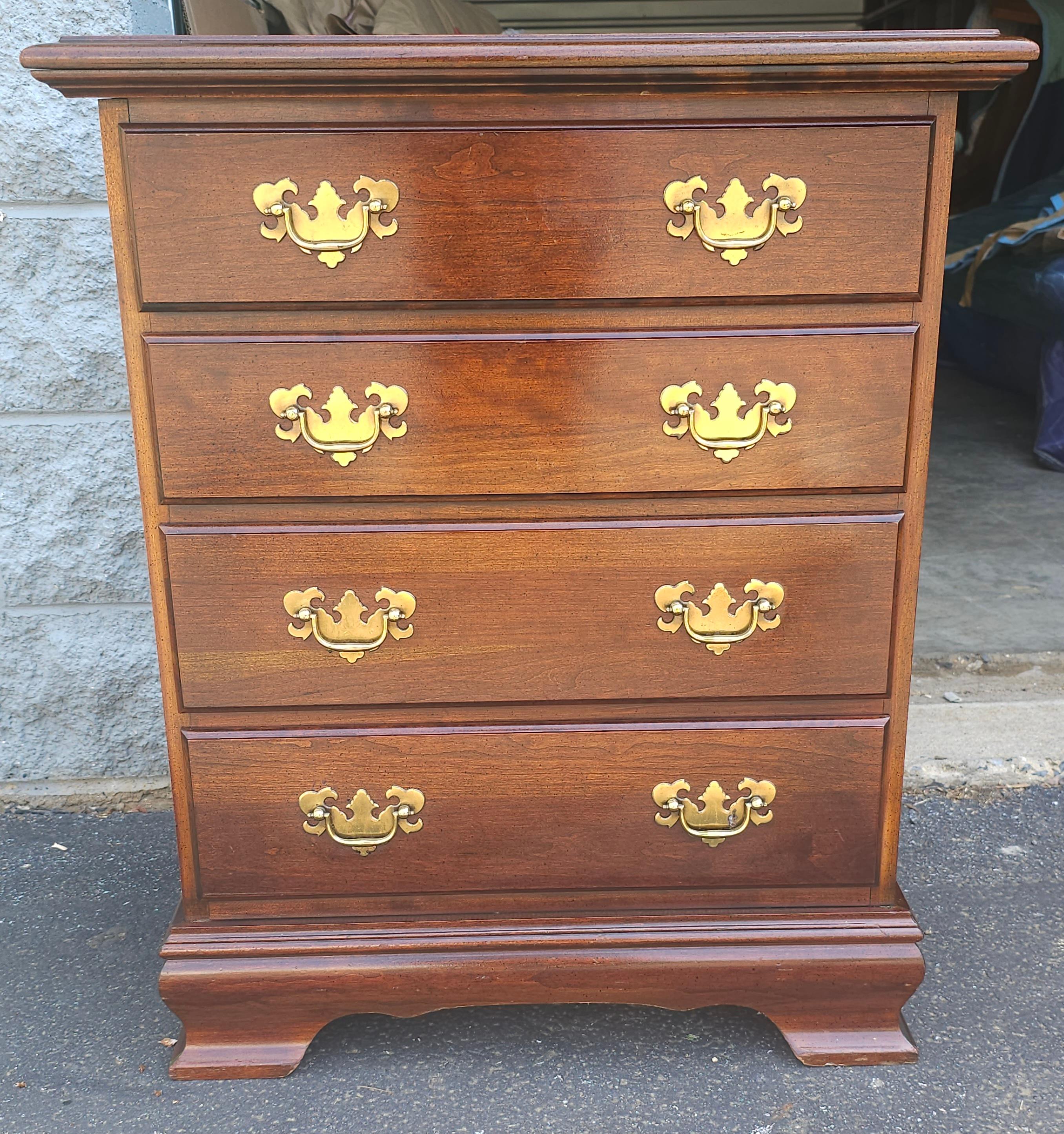 A 20th Century Chippendale Mahogany Four-Drawer Small Chest of Drawers with side handles. Measures 25