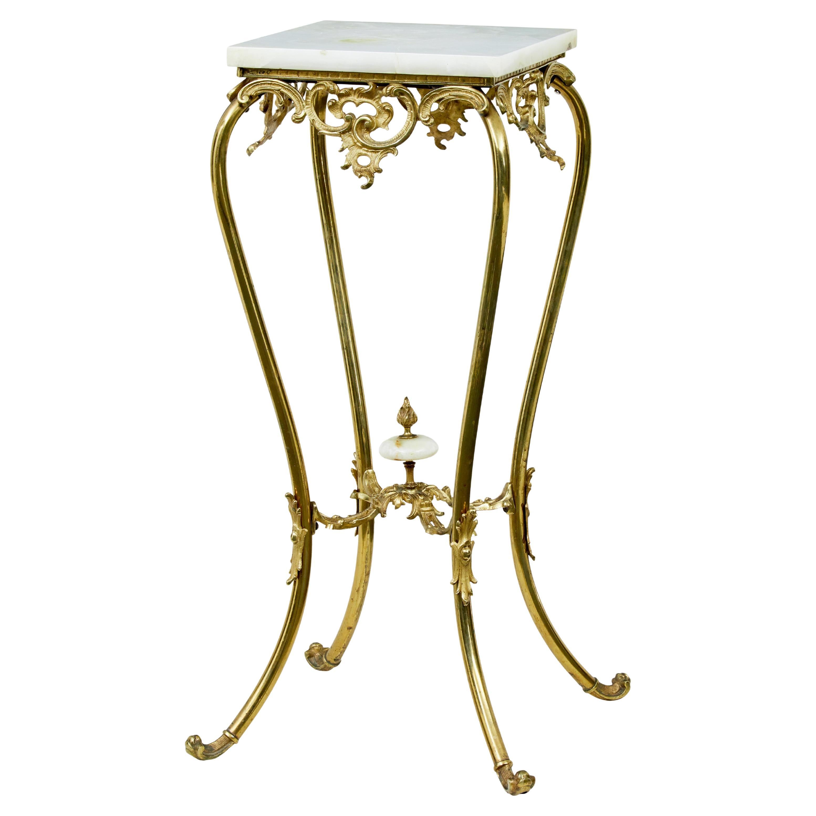 20th Century chiseled brass and oynx pedestal table