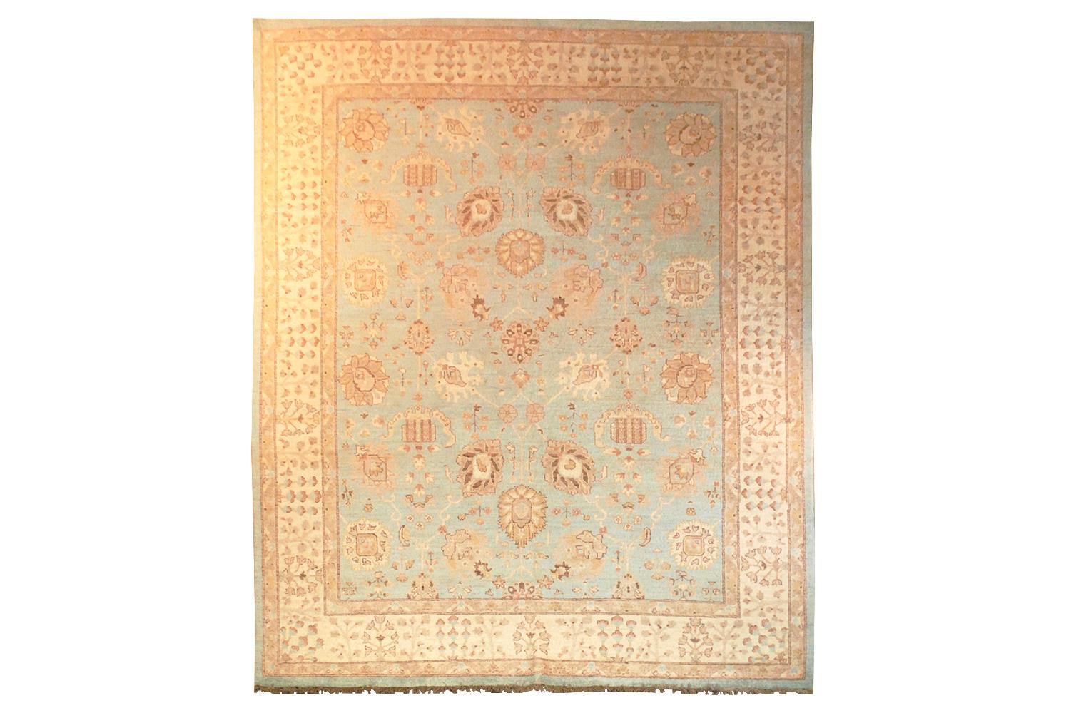 Chobi hand-knotted wool rug. Overall pattern in taupe, beige and brown. Background in shades of blue. Please note the rug has been photographed from both directions of weft to show light and dark directional weave. Measures: 8 x 9.