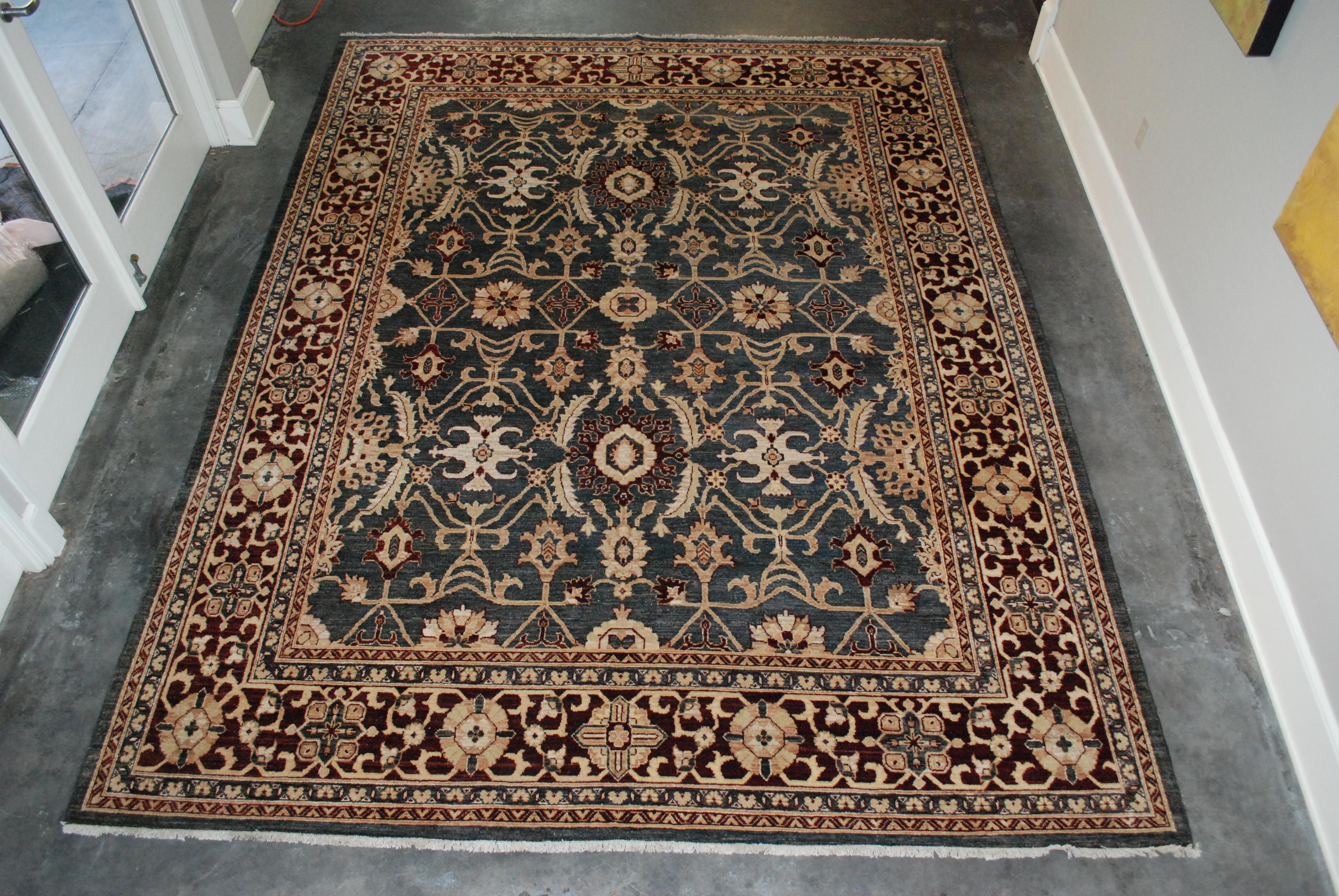Chobi hand knotted wool rug. Overall pattern in mostly charcoal grey with rust, beige, gold and burgandy. Note the images of the rug photographed from both weft directions to show light and dark direction of weave. Measures: 8 x 11.