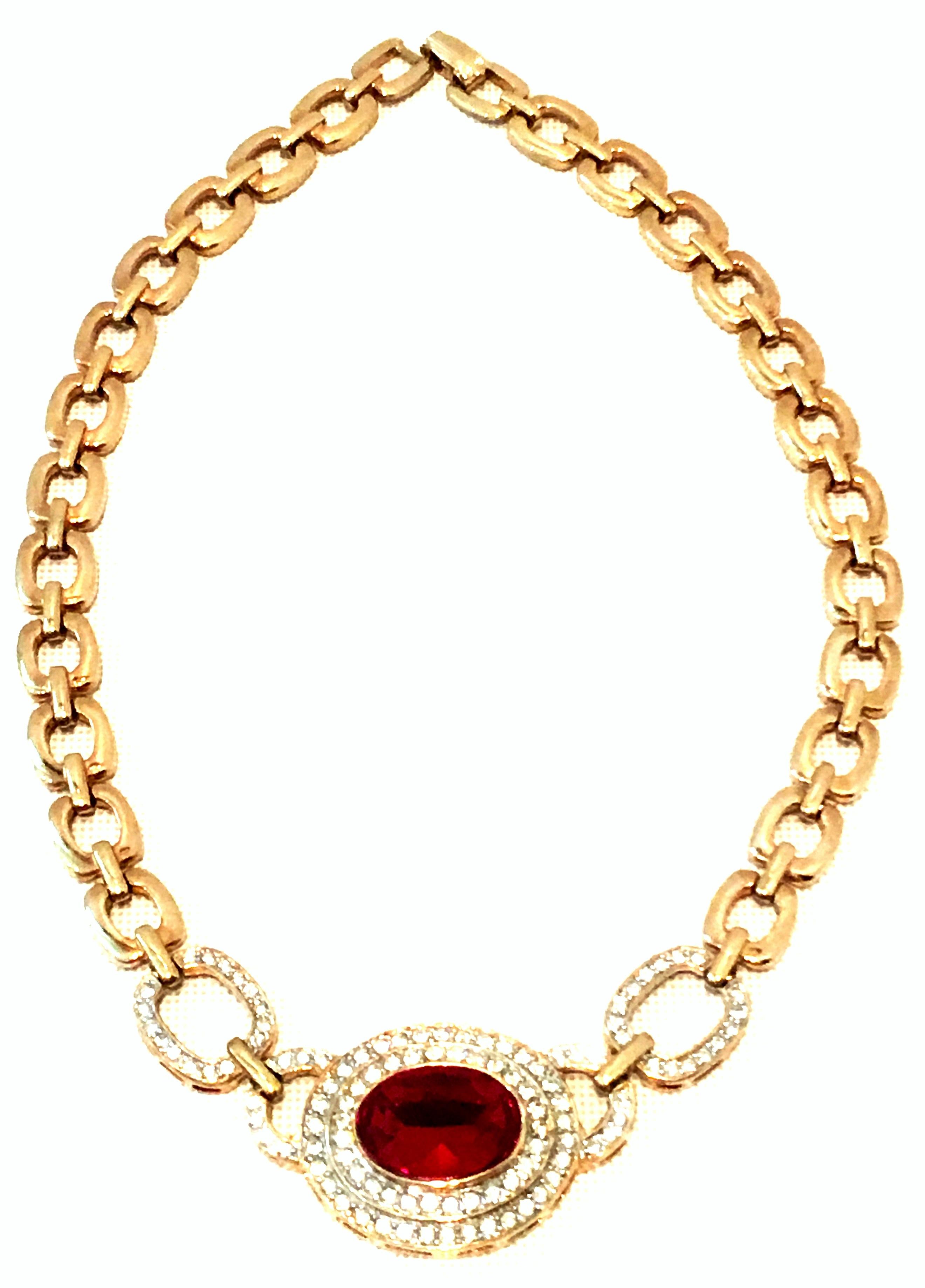 20th Century Christian Dior Style Gold Plate & Austrian Crystal Style Necklace. This gold plate choker style chain link necklace attributed to Christian Dior features a central ornament of paste set colorless brilliant cut and faceted stones with a