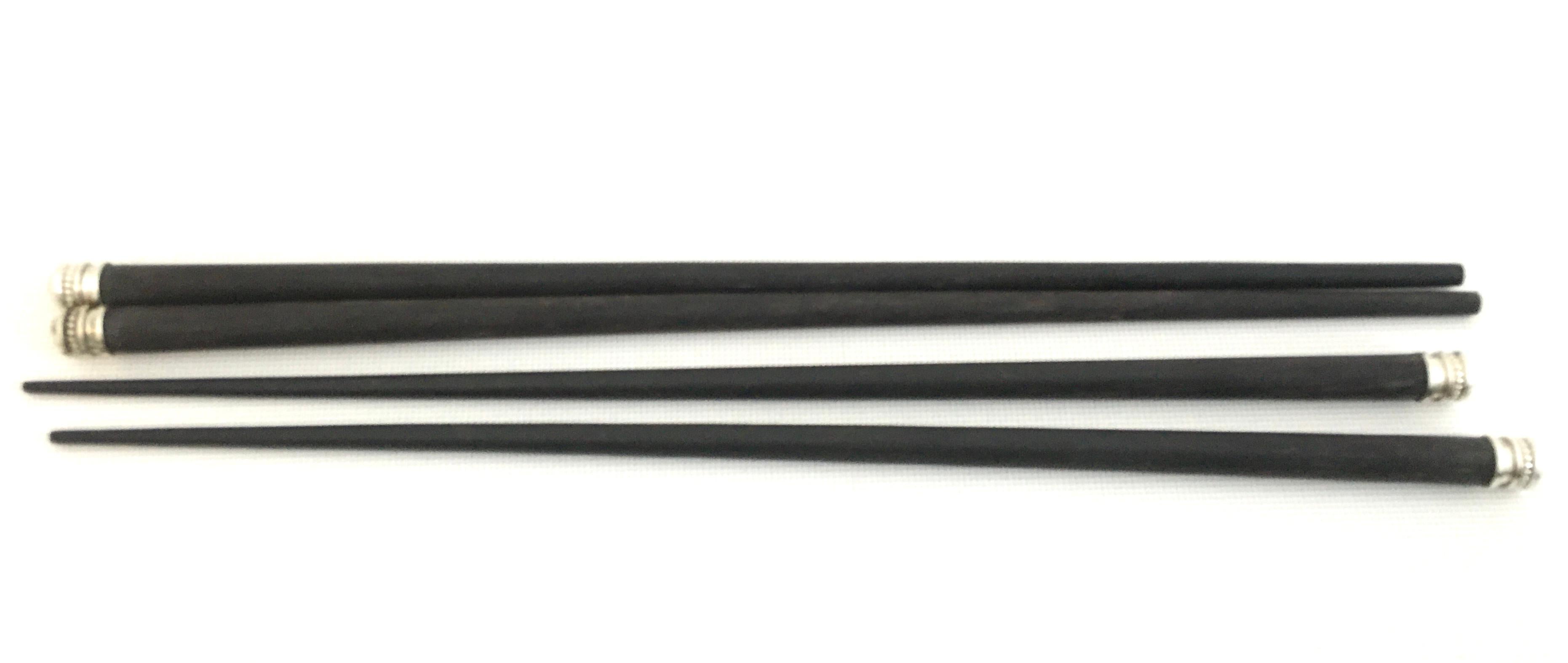 20th century Christofle silver France sterling silver & ebony chopsticks., Two Pairs. One pair is Japanese in style the other pair is Chinese is style. Both pairs are identical in features. Each chopstick is marked with the French 925 sterling