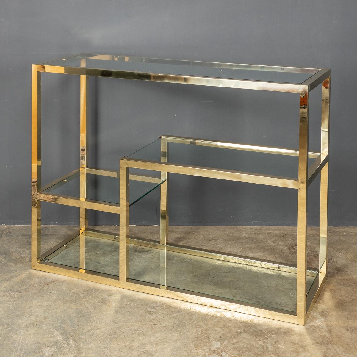 Stylish 20th Century smart four tier etegere with glass shelves of various sizes in a sturdy highly polished brass frame, c.1970.

CONDITION
In Great Condition - wear as expected.

SIZE
Height: 90cm
Width: 120cm
Depth: 45cm.