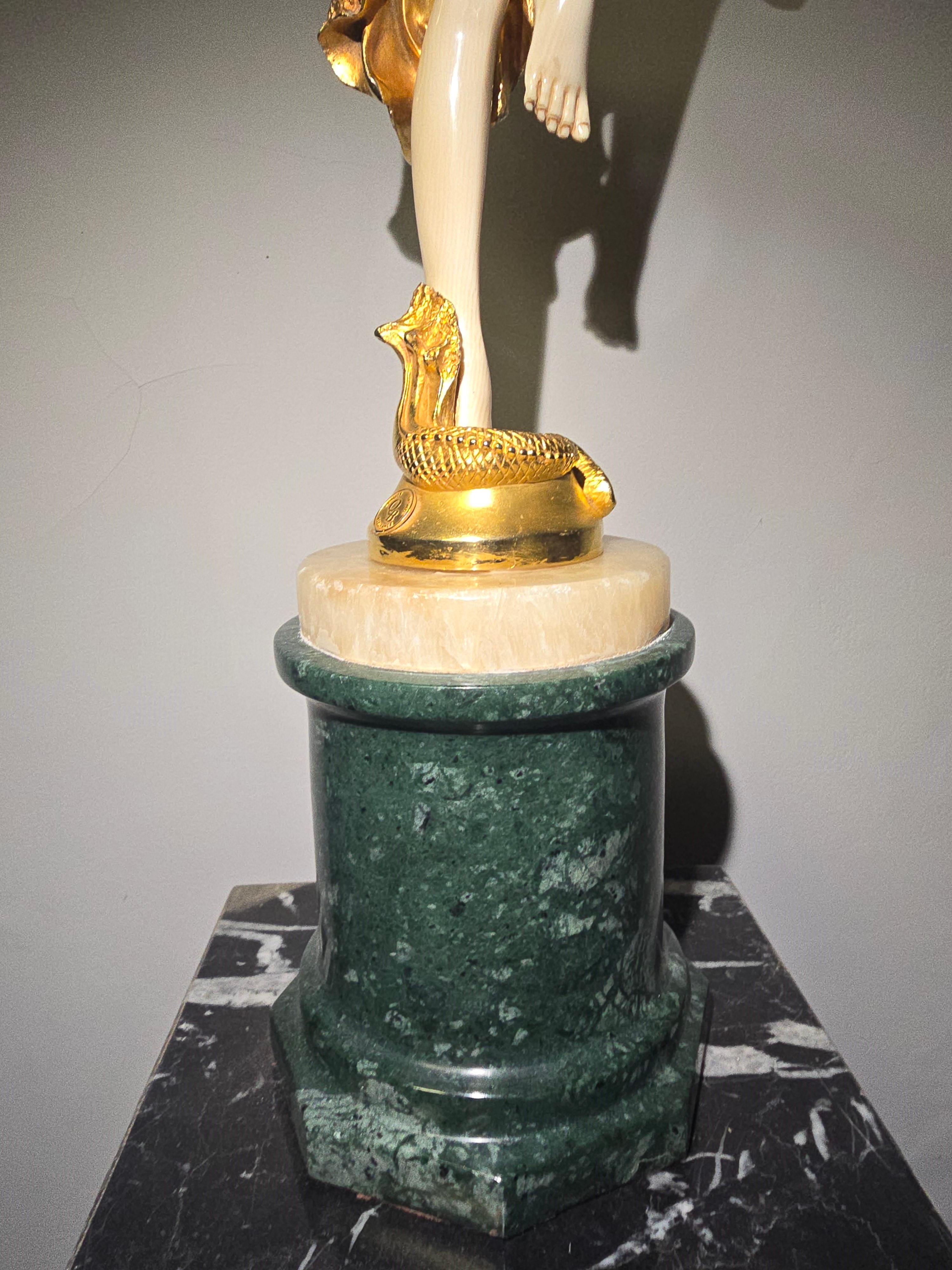 20th-Century Chryselephantine Sculpture by J.R. Colinet

Elegant chryselephantine sculpture crafted in gilded bronze and mounted on a marble base. Signed 