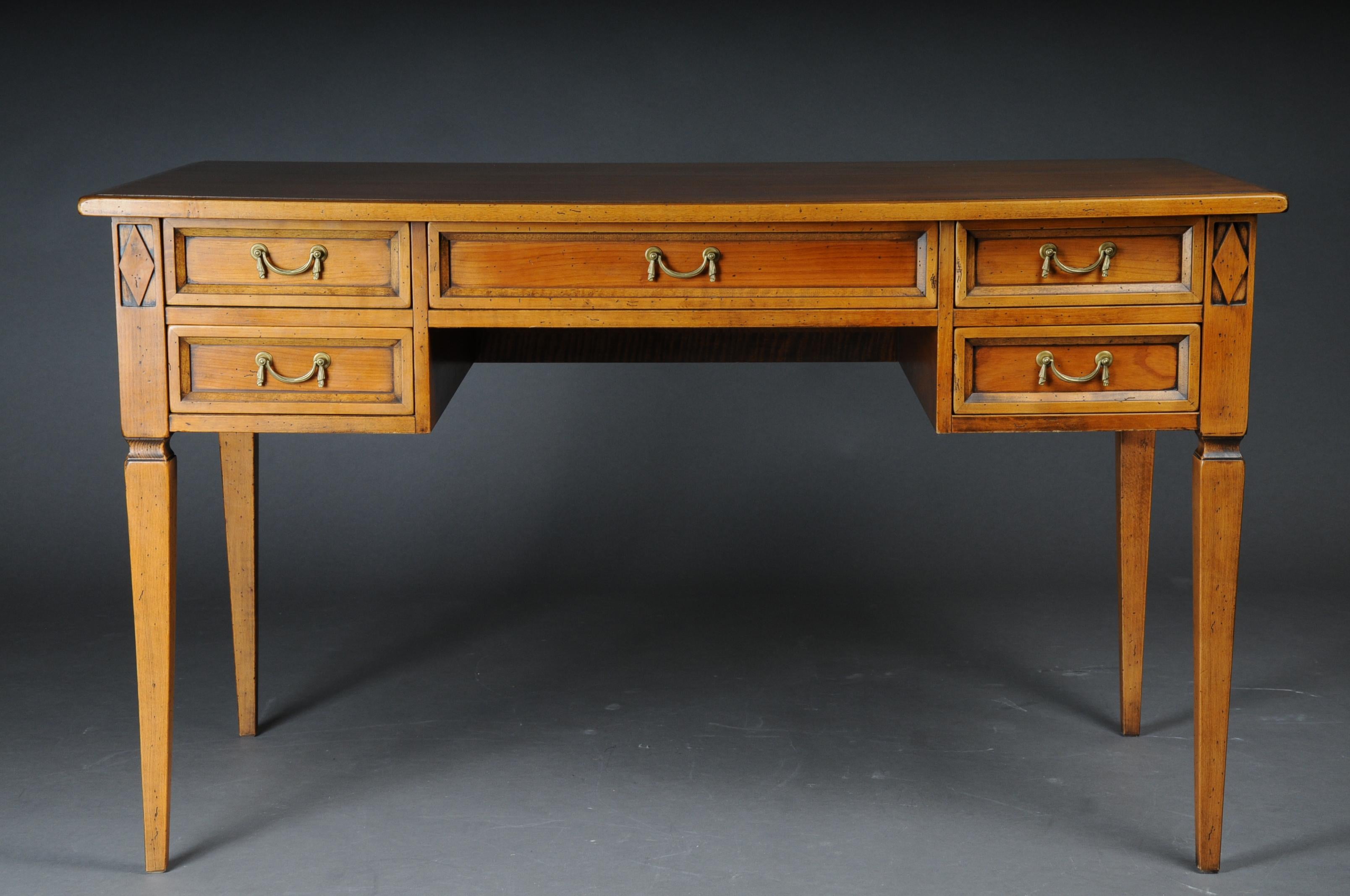 20th century Classic desk in the style of classicism.
Solid wood and cherry veneer. Longitudinal rectangular table top with five drawers, cut-out frame for legroom and square legs tapering downwards. Nice patina, hand polish with