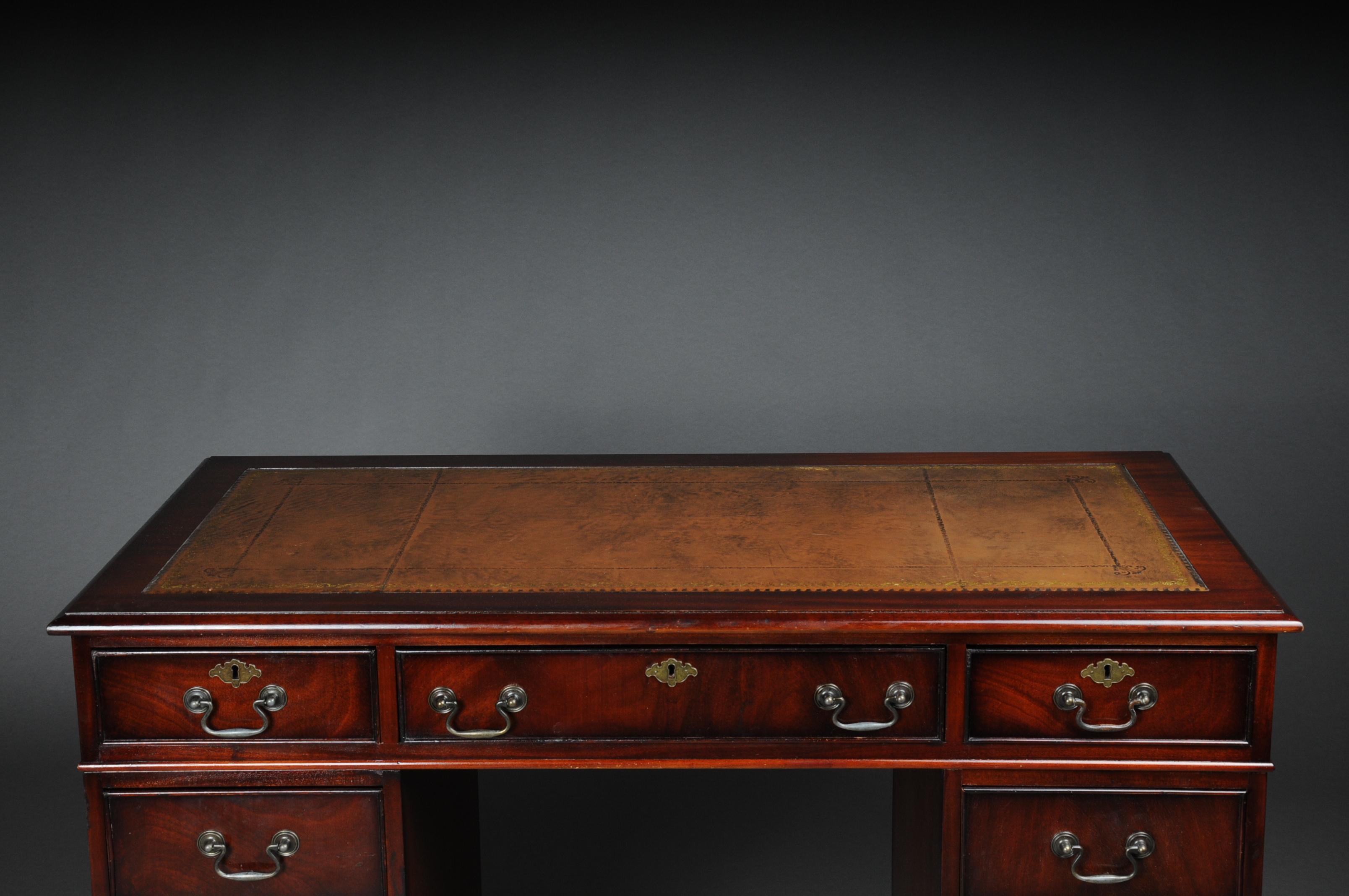 Solid wood and mahogany stained body. Leather-covered worktop and finished with gold trim.
Freely adjustable in the room. Desk consists of three parts (2 containers + worktop). The desk is an absolute classic and fits in every household / office.