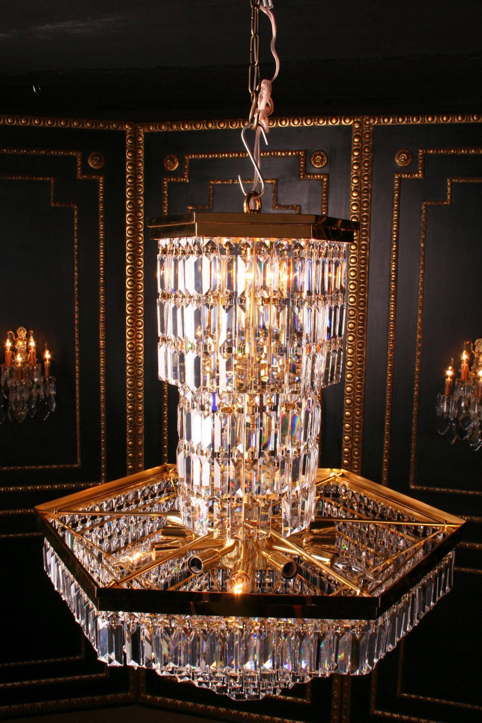 20th century classicist style ceiling chandelier
Ceiling chandelier in classicist style.
Polished brass with faceted crystal.

Delivery time can take about 8-12 weeks

(F-Asf-1).