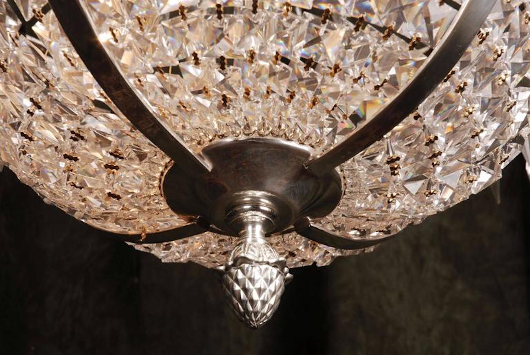 Swedish Empire ceiling candelabra in classicist style.
Polished, silvered brass and facett-ground prism hangings.

(F-Ra-83).