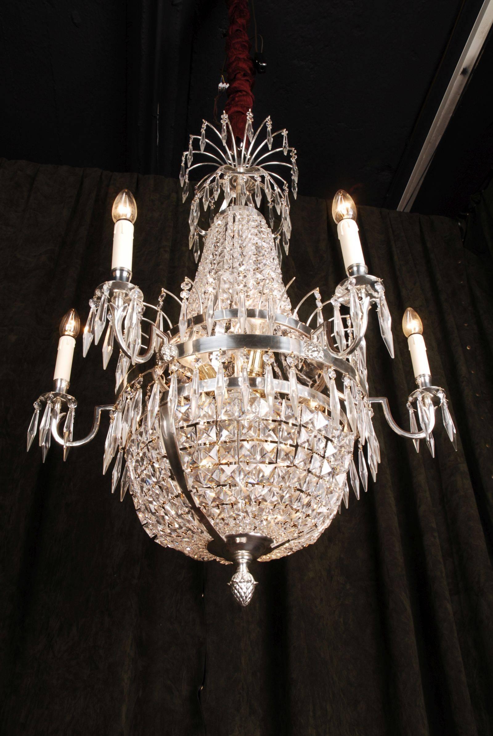 Swedish Empire ceiling candelabra in classicist style.
Polished, silvered brass and facett-ground prism hangings.

(F-Ra-81).