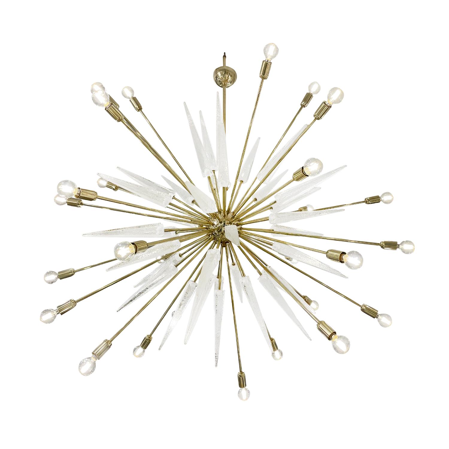 A large, vintage Mid-Century Modern Italian Sputnik chandelier, pendant made of hand blown smoked Murano glass, in good condition. Each glass rays, spikes are halted by the round polished brass base, frame. The ceiling light, lamp is composed with a