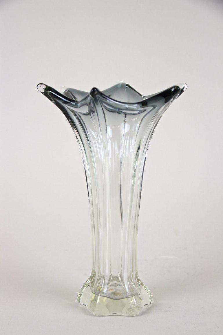 Very decorative mid century Murano Glass Vase out of the renown workshops on the small island of Murnano. this Vetro Artistico Veneziano glass vase was crafted in Italy in the period around 1960/70. The lovely shaped clear glass body alongside the
