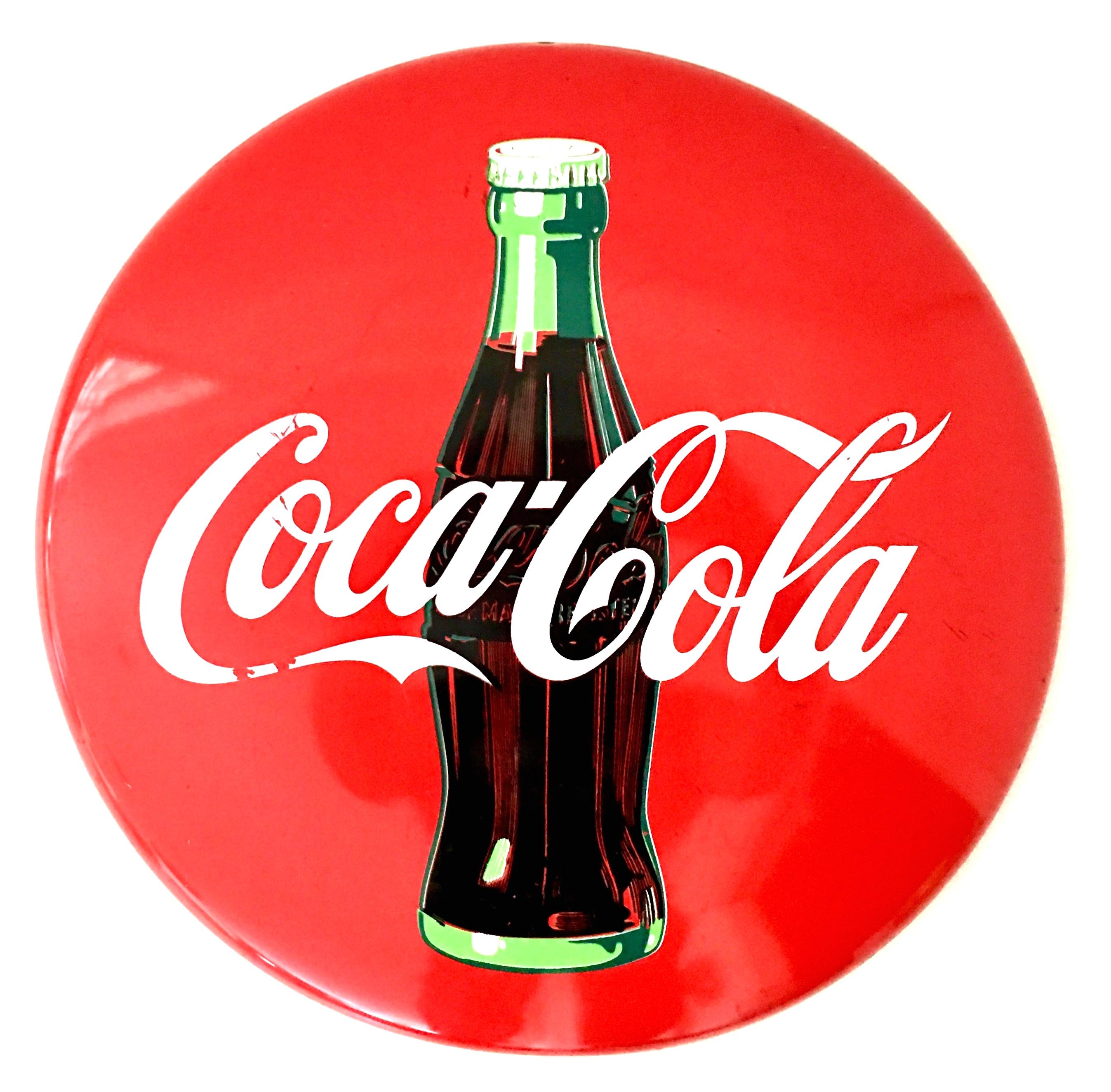 1992 Coca-Cola enamel on iron round disc red button and bottle advertising sign.
Signed on the lower front, 1992 The Coca-Cola Company. Ready to hang with original pre-drilled hole.