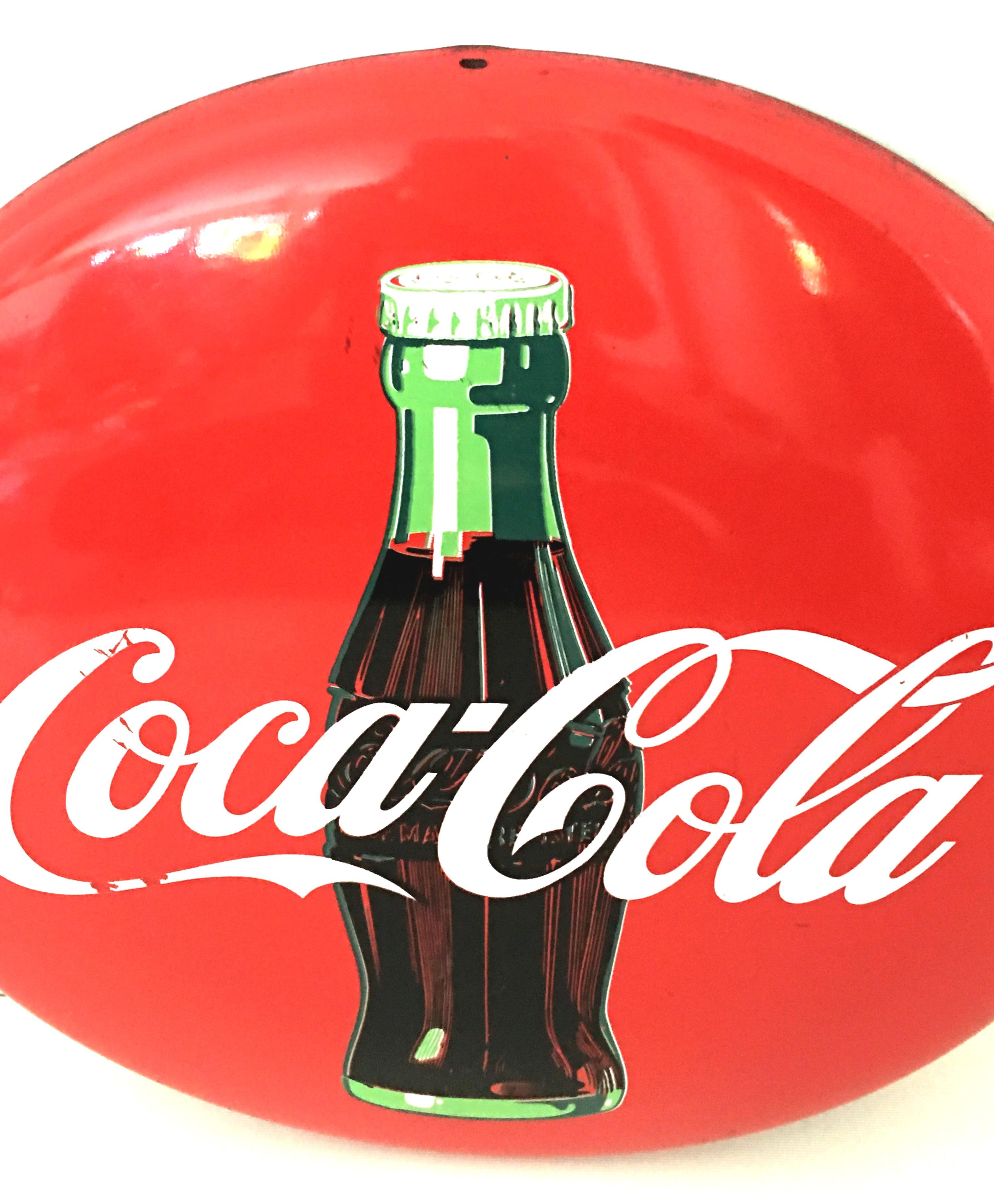 round coca cola sign